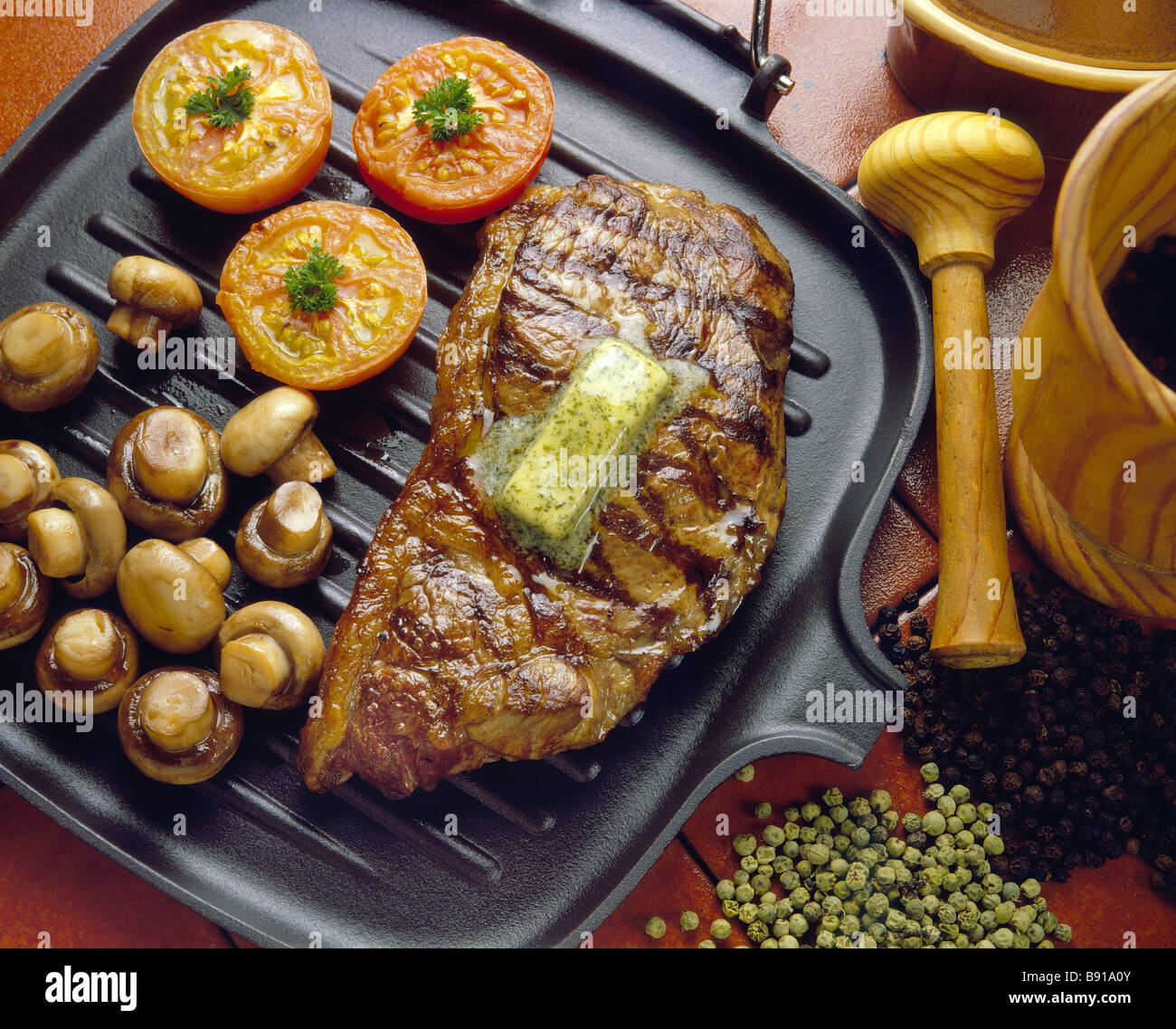 Steak on Griddle pan with mushrooms and tomatoes Stock Photo Alamy