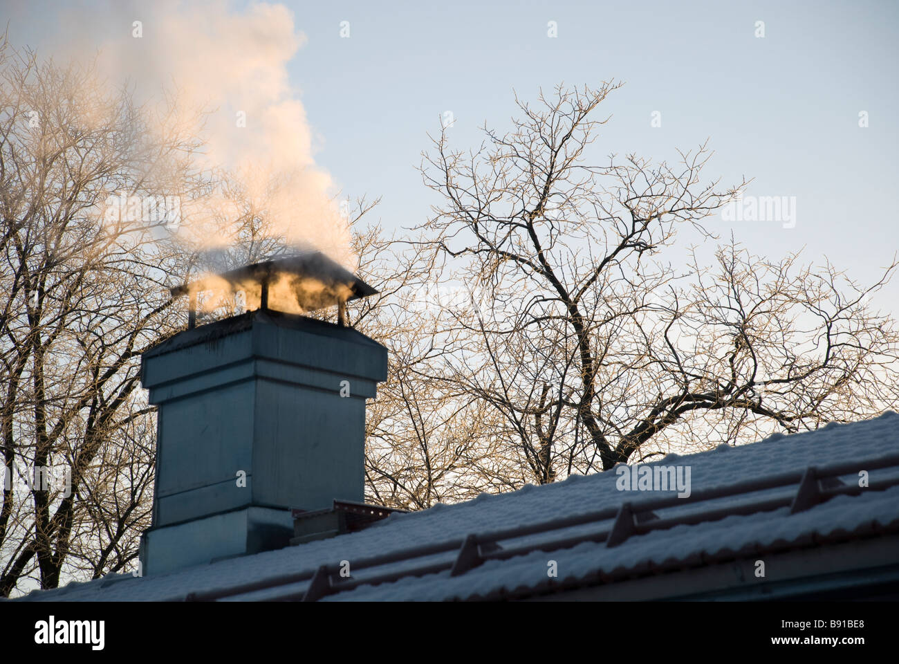 Smoke coming out of the chimney Stock Photo Alamy