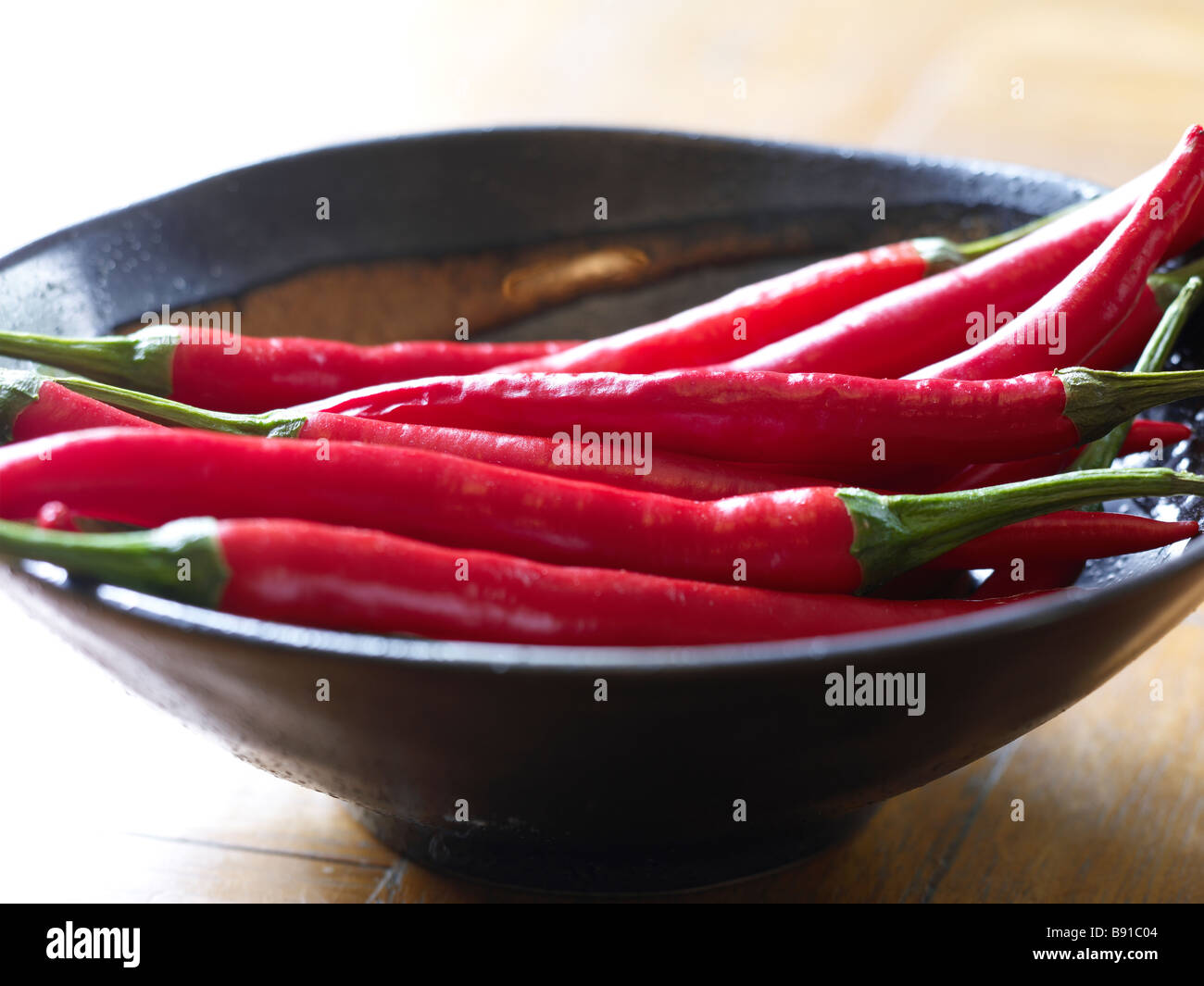 Bowl of fresh red chillies Stock Photo
