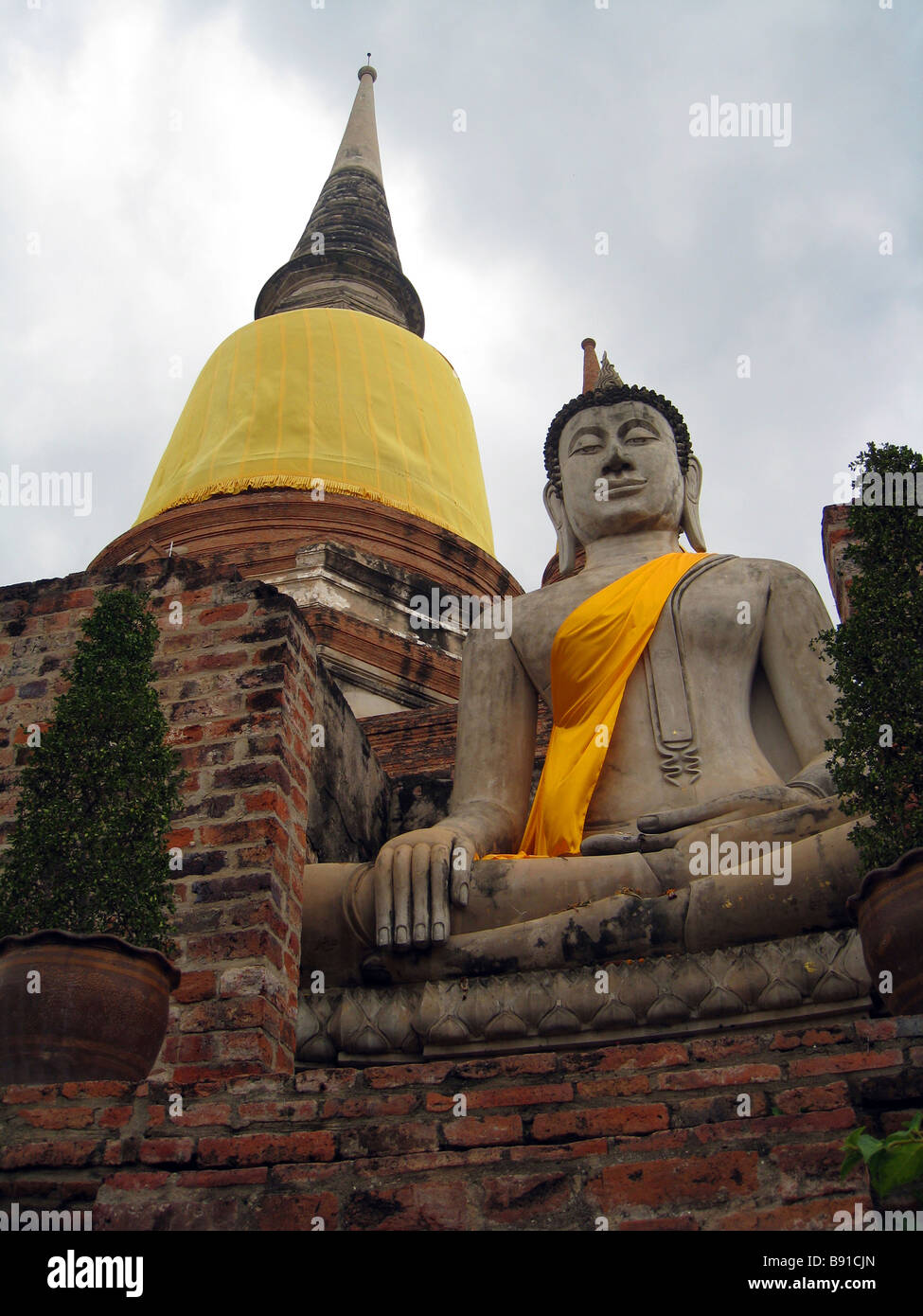Buddhist statue wearing royal yellow at temple in Ayathaya Stock Photo