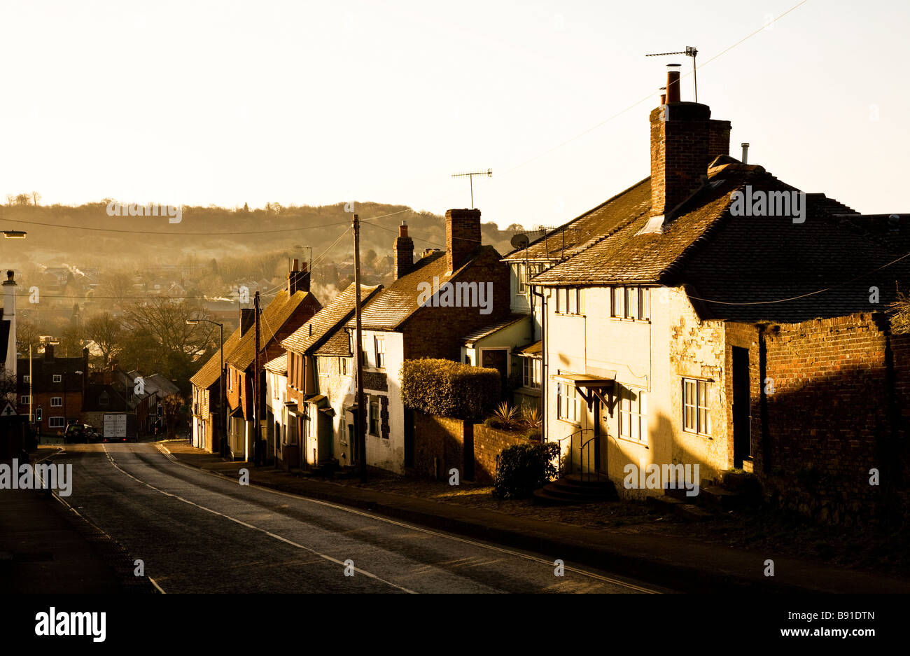 Early morning light falls on the houses along Barn Street in the typical English market town of Marlborough Wiltshire England UK Stock Photo