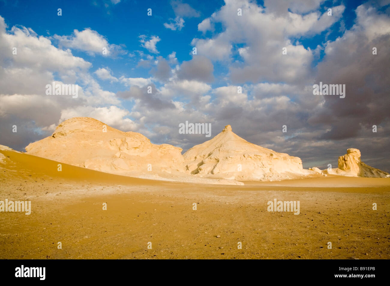 Inselburgs with surrounding ridged sand , White Desert , Farafra , Egypt , Africa Stock Photo
