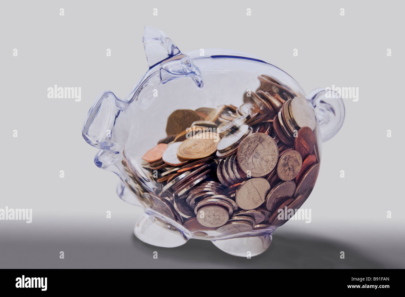 Clear glass piggy Bank on white background Stock Photo - Alamy