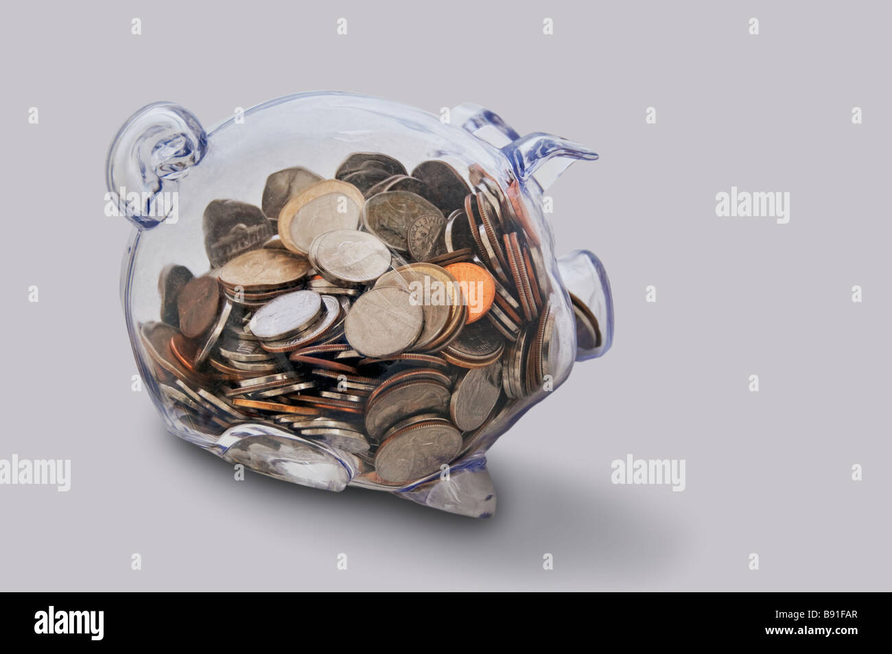 Clear glass piggy Bank on white background Stock Photo - Alamy