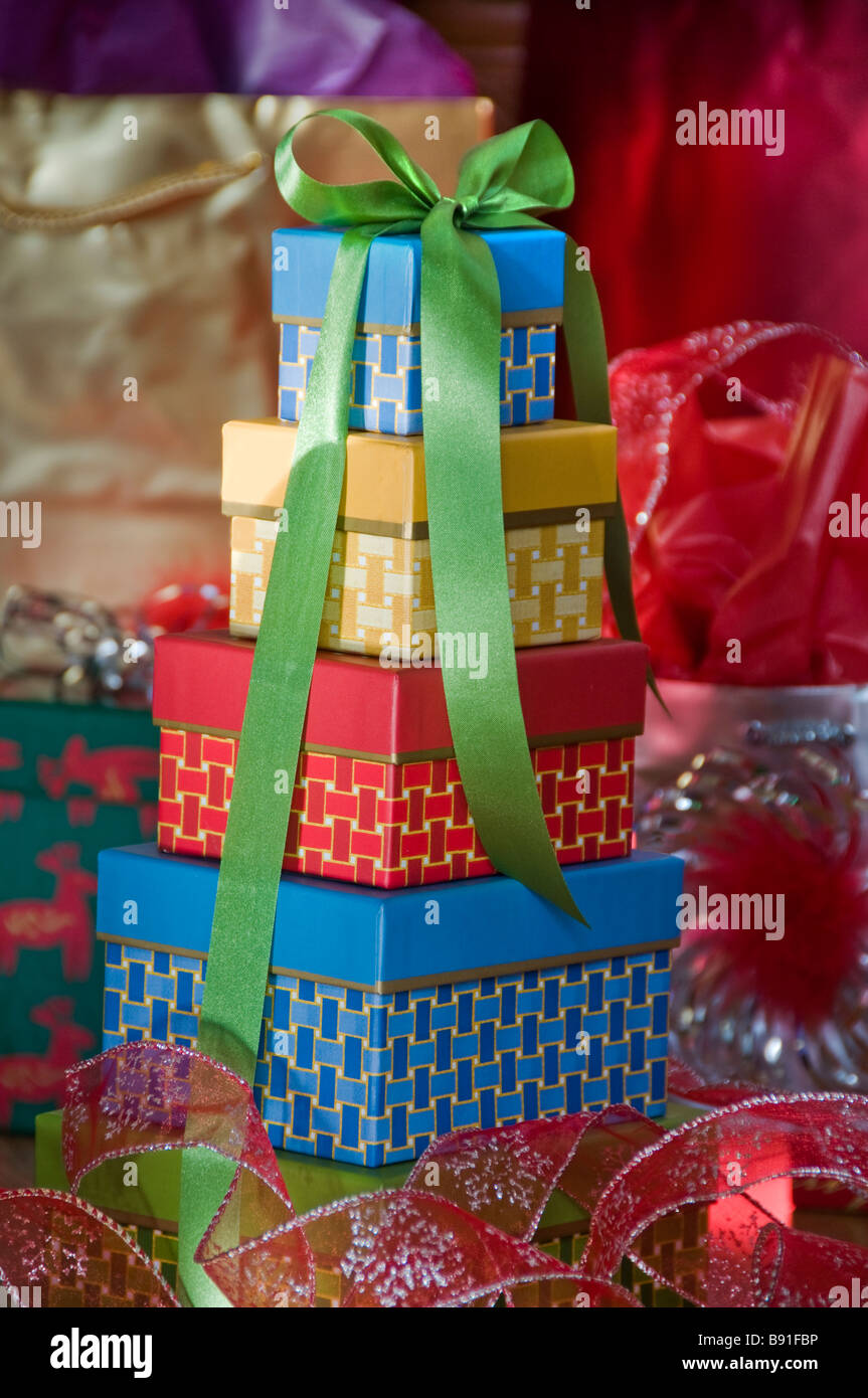 Stacked gift boxes with green bow Stock Photo Alamy