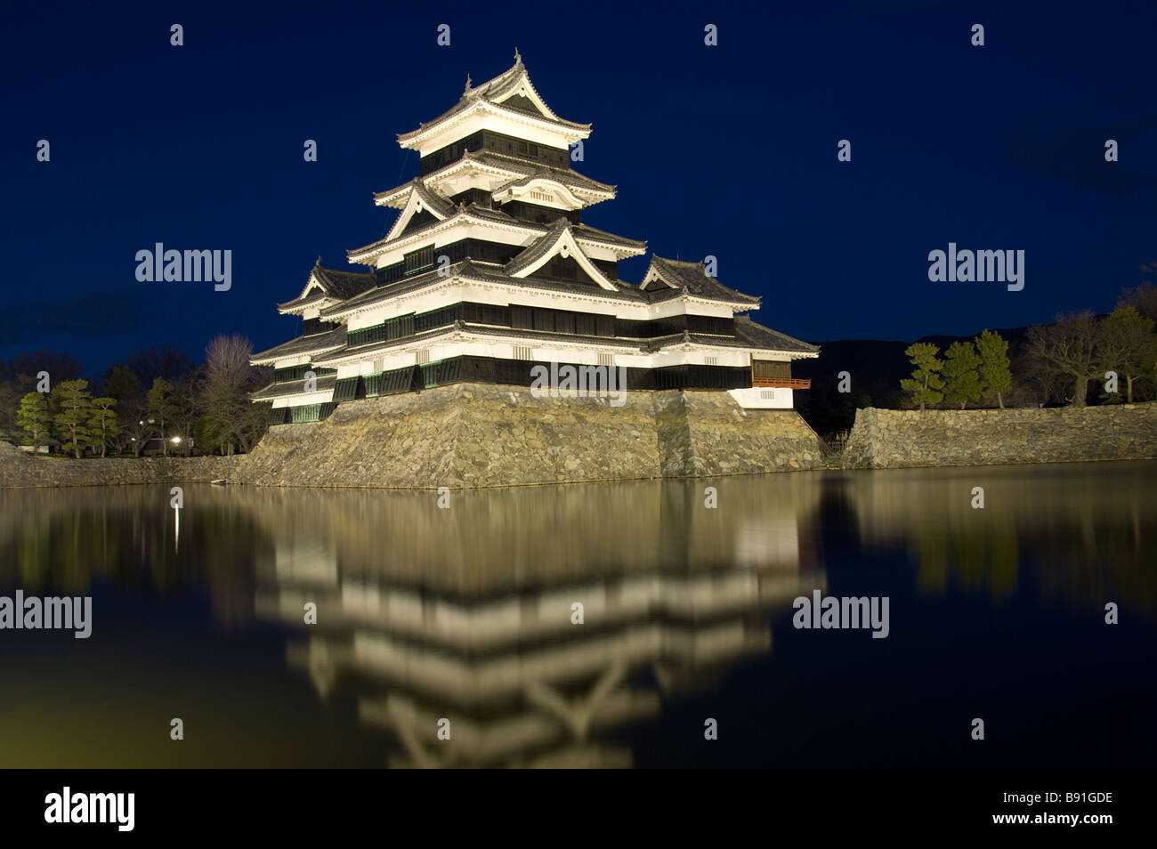 Matsumoto castle by night against a blue sky Stock Photo