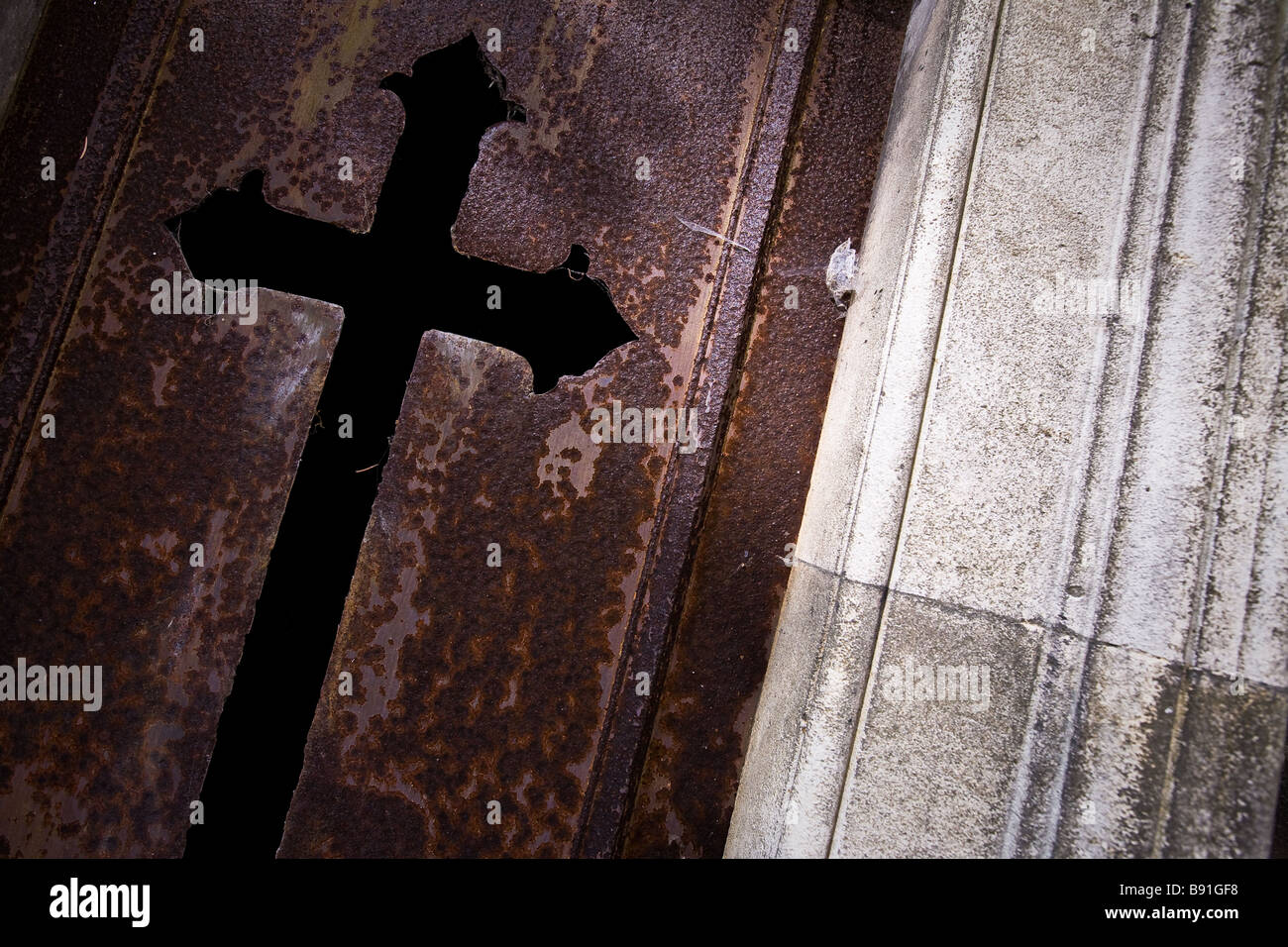 Rusting tomb door in the famous graveyard Pere Lachaise in Paris. Stock Photo