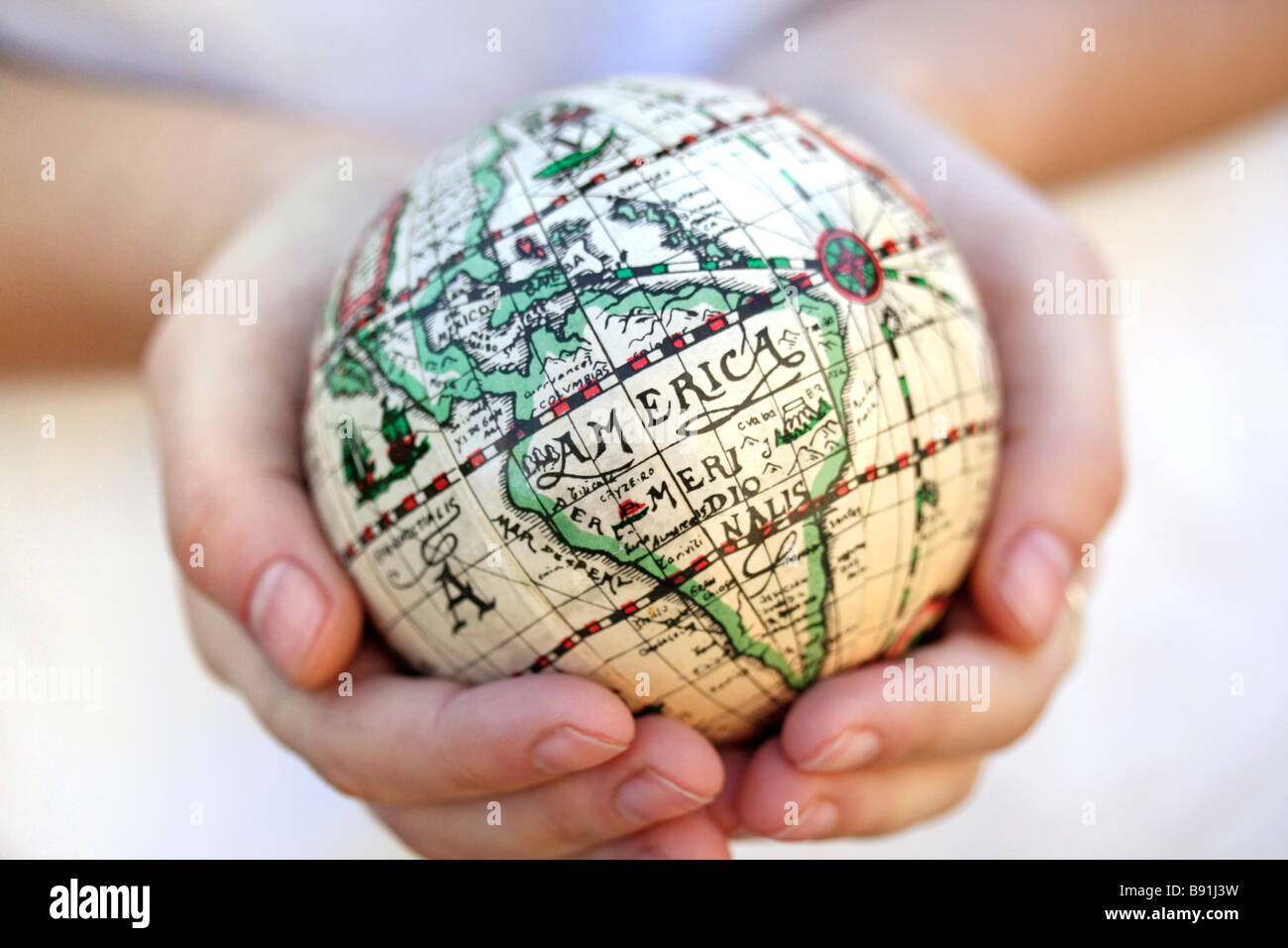 Cupped hands holding planet earth hi-res stock photography and images ...