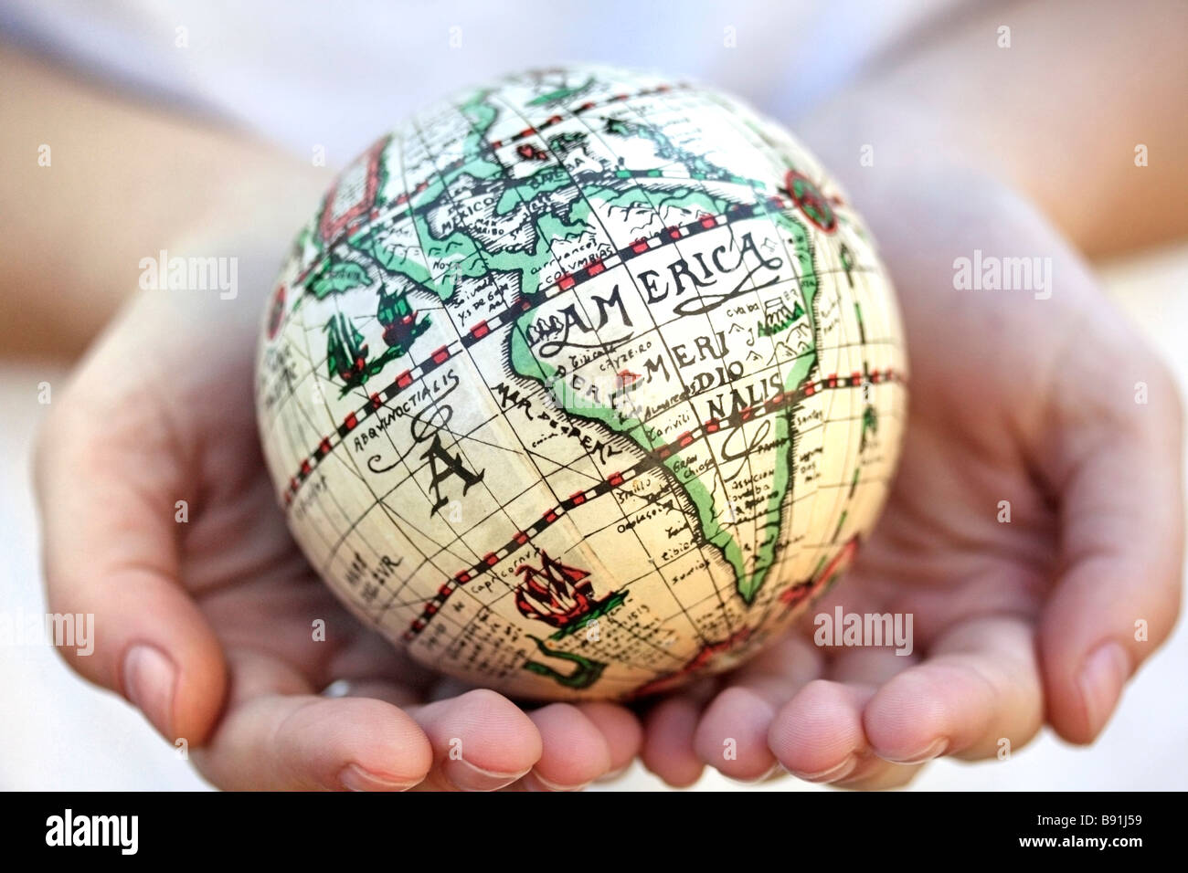 Cupped hands holding planet earth hi-res stock photography and images ...
