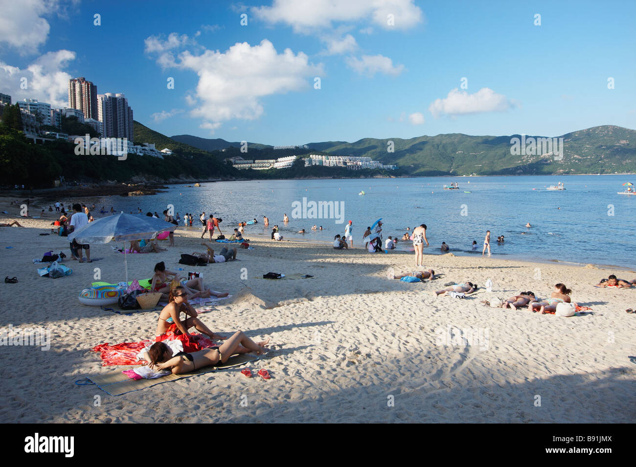 People Sunbathing On Stanley Main Beach, Hong Kong Stock Photo