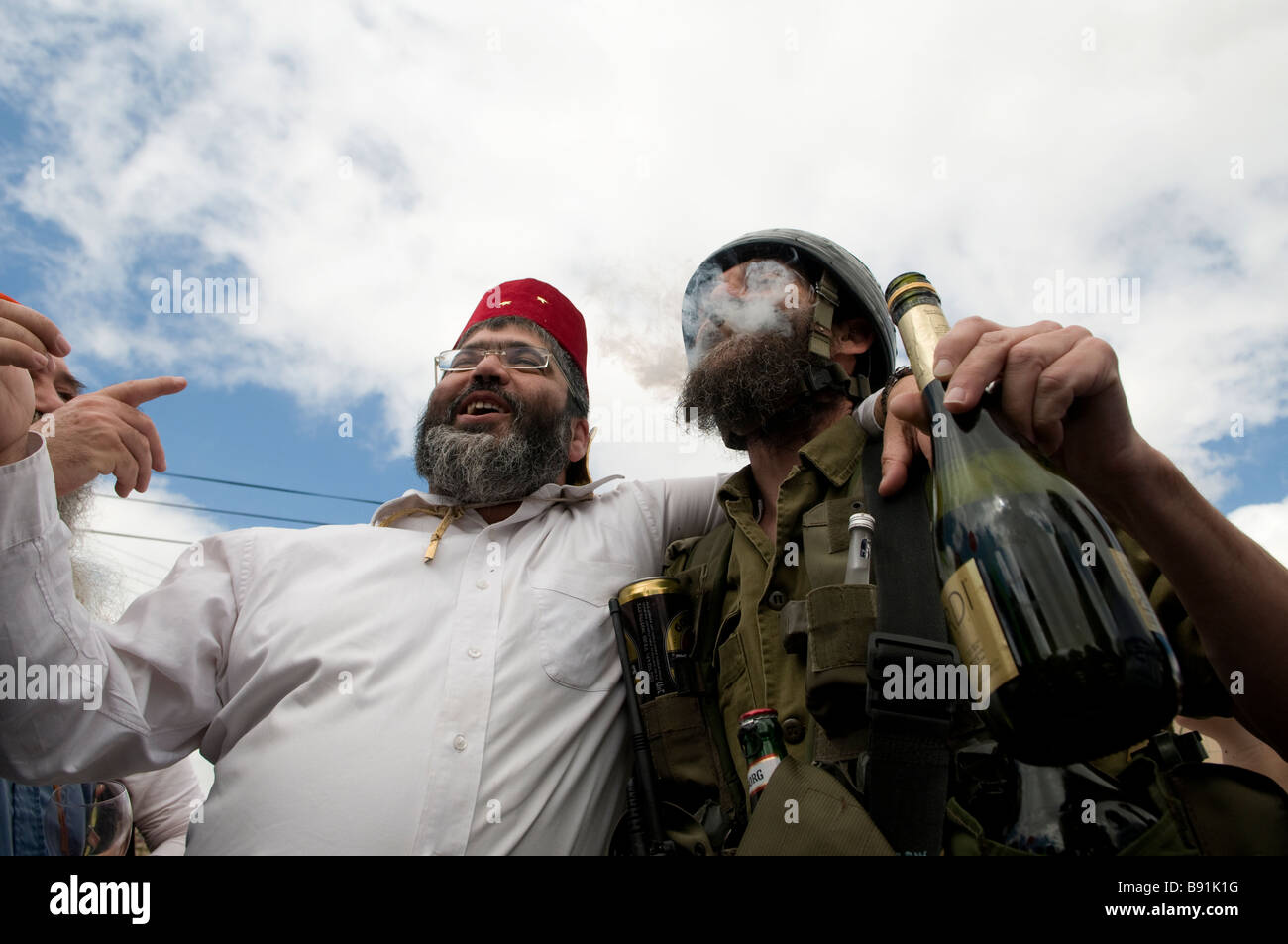 Drunk Jewish settler wearing military costume marks the Jewish holiday of Purim in the divided West Bank town of Hebron Israel Stock Photo