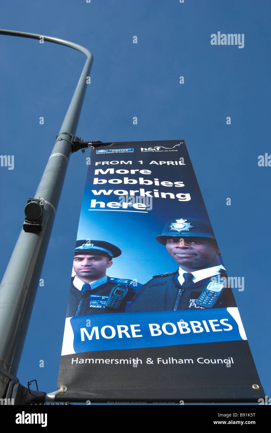 hammersmith and fulham council sign announcing more police, or bobbies, to be working in the west london borough Stock Photo