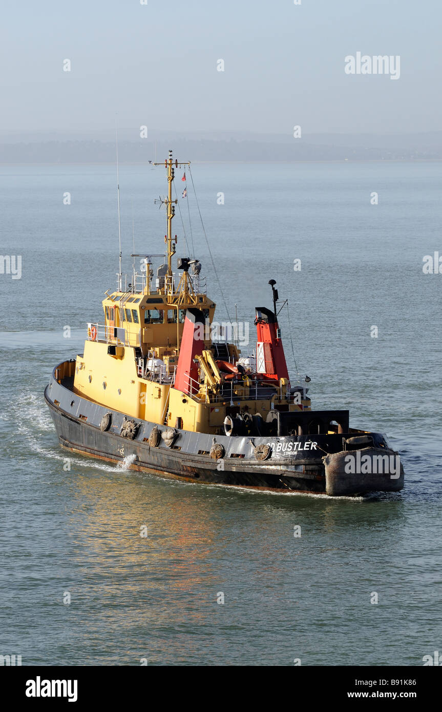 Serco Denholm SD operated vessel on Portsmouth Harbour southern England UK Tug Powerful seen with a backdrop of Hasler Marina Stock Photo