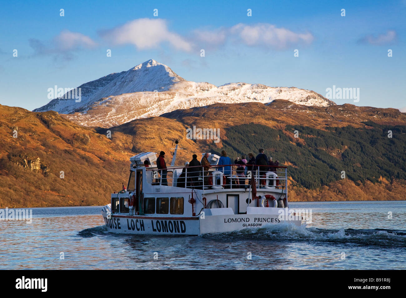 Passengers being ferried across Loch Lomond below Ben Lomond from Inveruglas to the Inversnaid hotel, Loch Lomond,  Scotland. Stock Photo