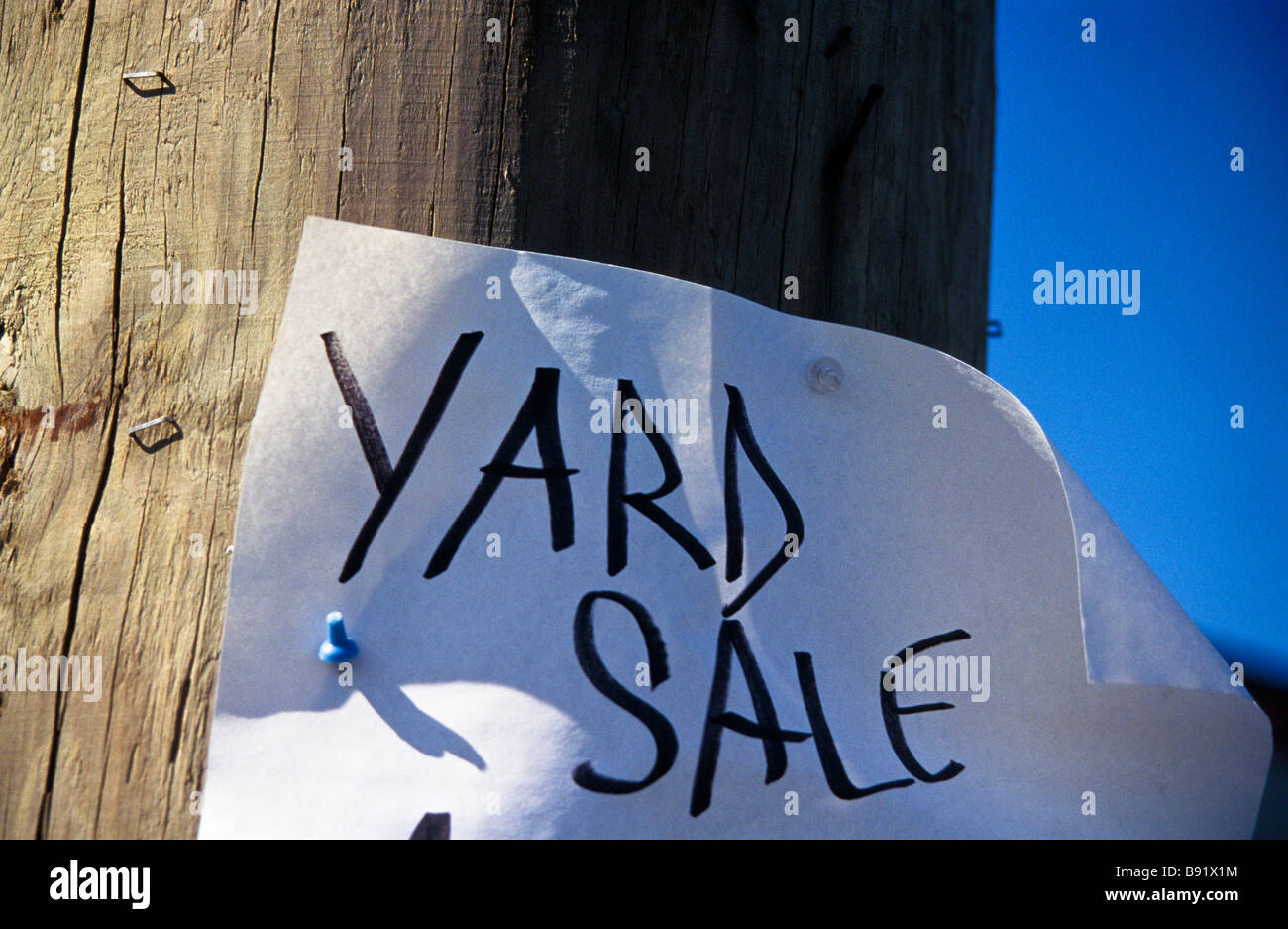 Hand made poster on utility pole for local yard sale Stock Photo