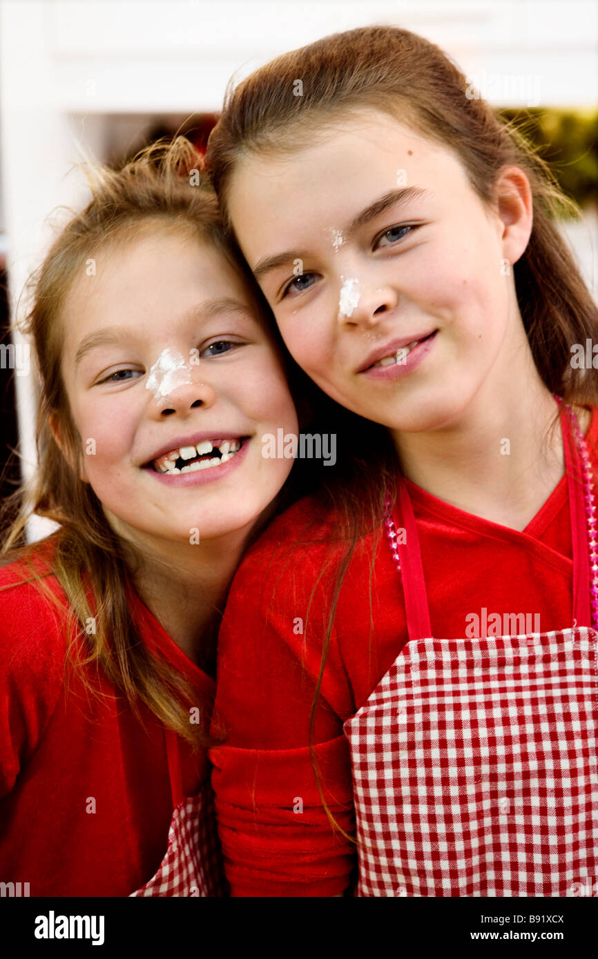 Two sisters at home during Christmas time Sweden Stock Photo Alamy