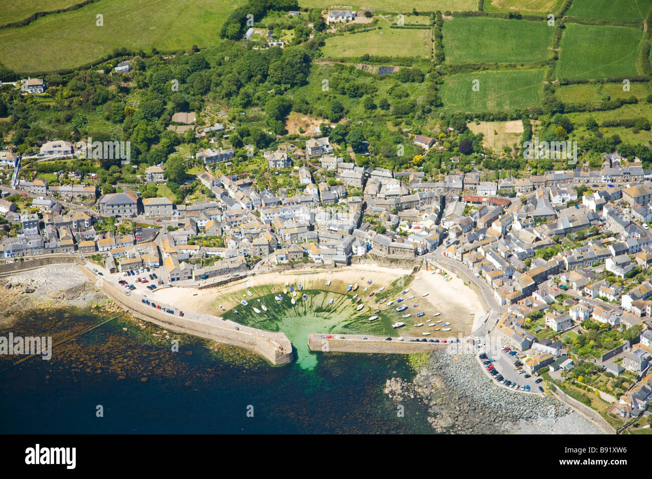 Aerial view of Mousehole harbour in summer sun Cornwall England UK United Kingdom GB Great Britain British Isles Europe EU Stock Photo