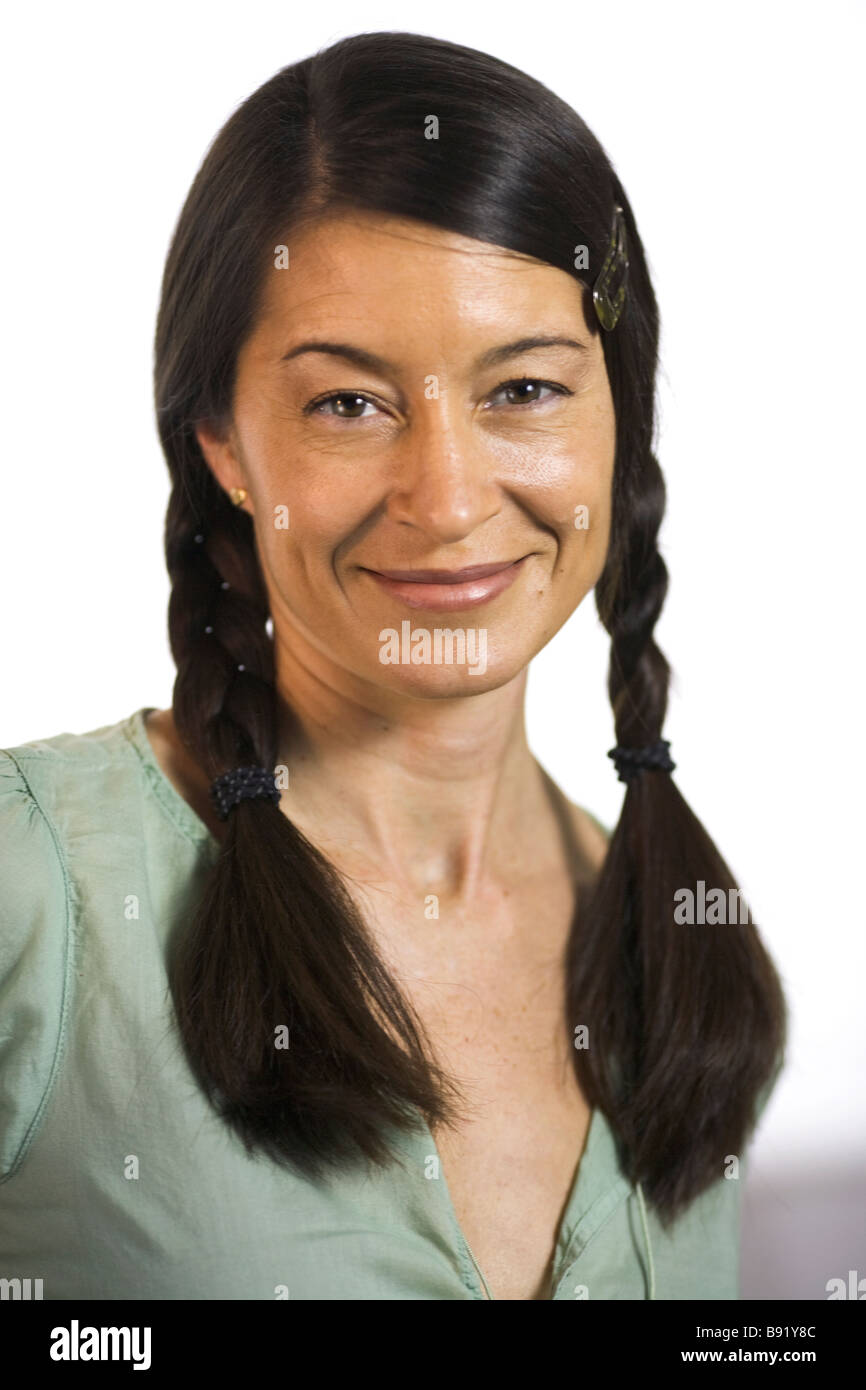 Portrait of a smiling woman with braids Stock Photo - Alamy