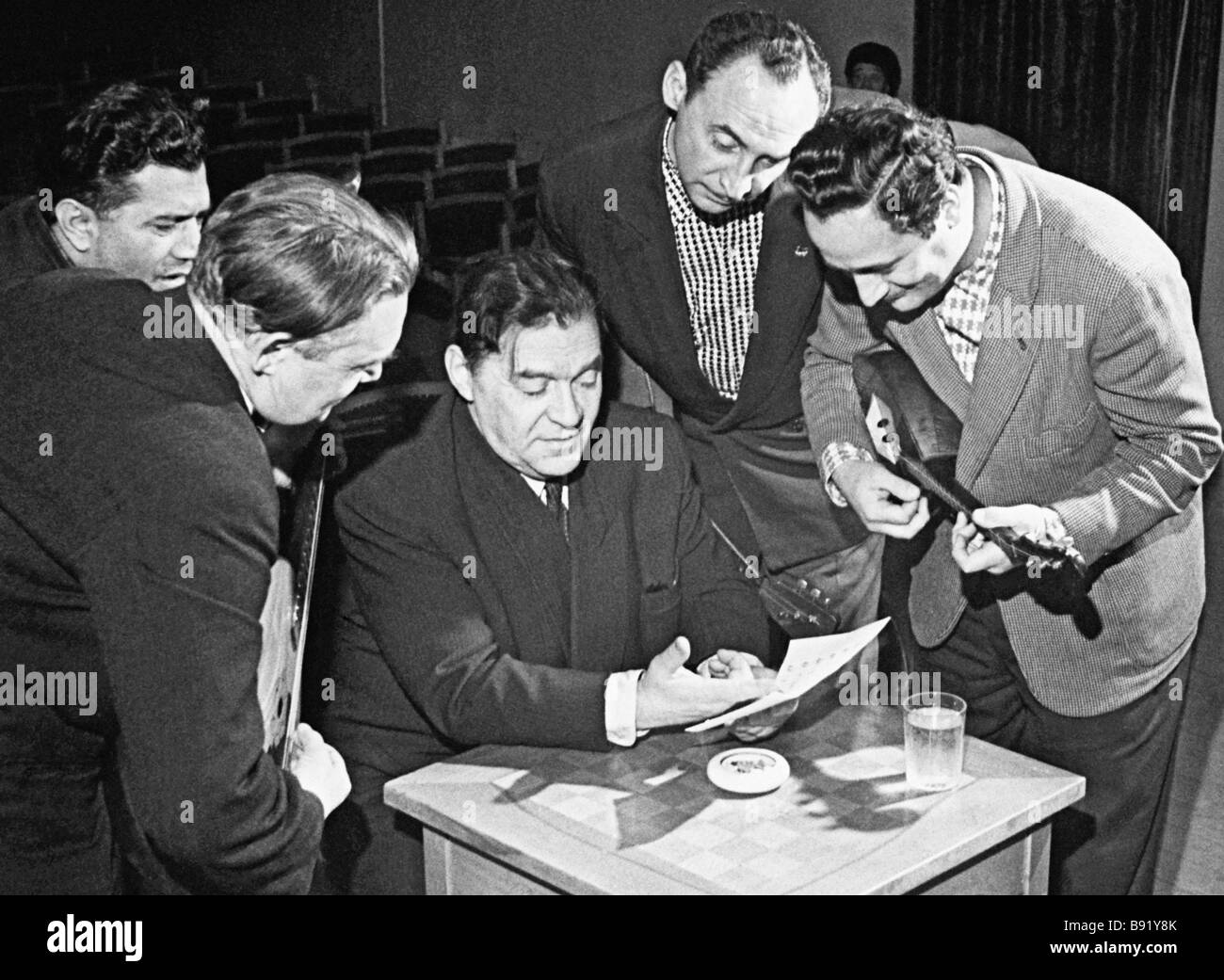 Band director Leonid Utesov 1895 1982 talking to musicians in the ...