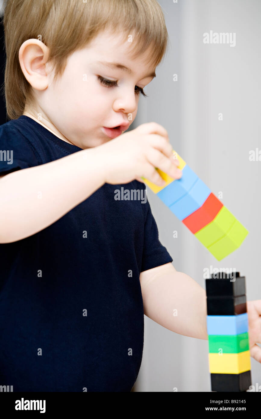 A little boy playing with Lego Sweden. Stock Photo