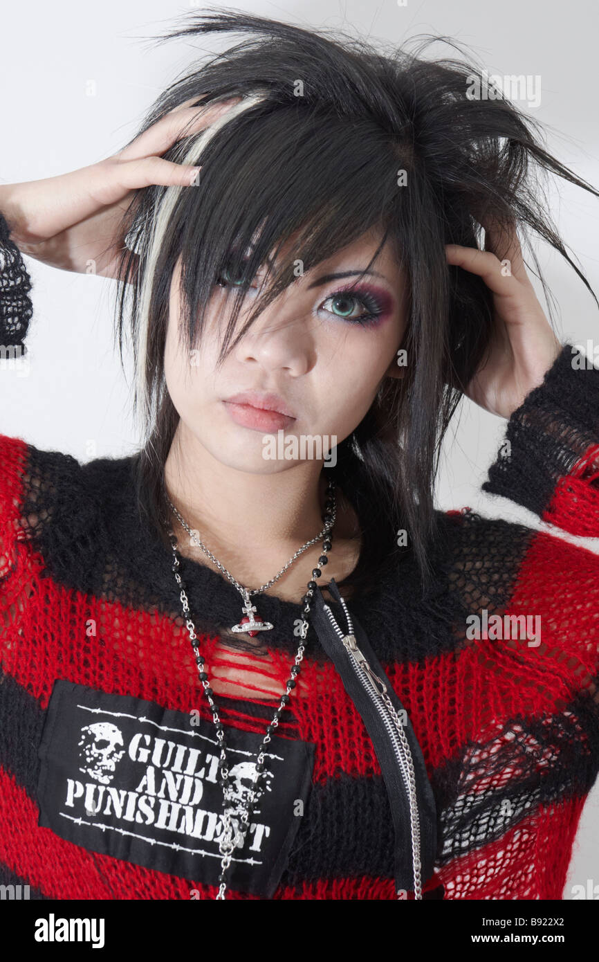Young japanese woman in style of visual kei with black red