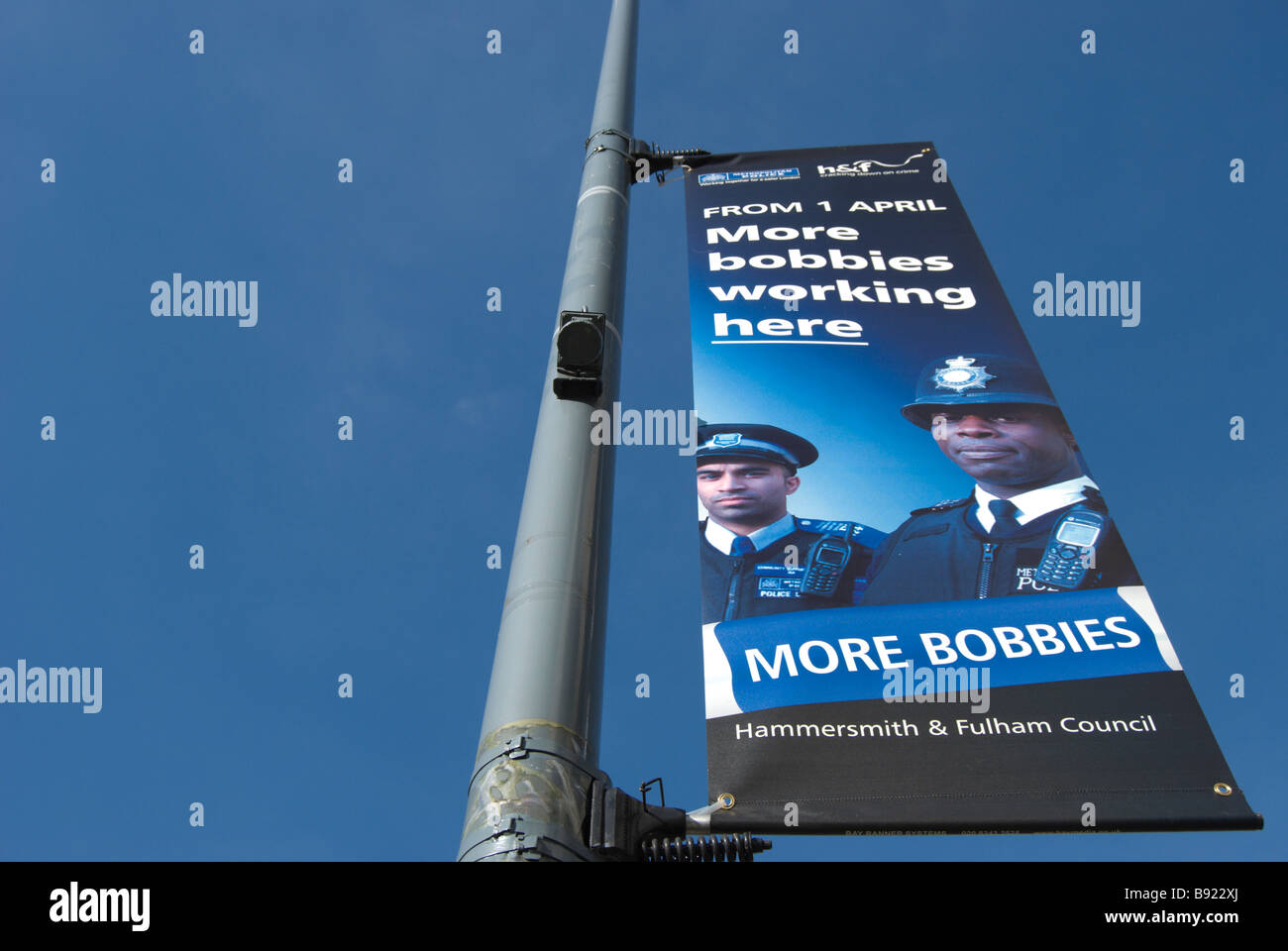 hammersmith and fulham council sign announcing more police, or bobbies, to be working in the west london borough Stock Photo