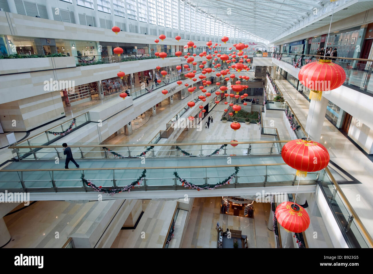 Interior view of atrium of modern upmarket Seasons Place shopping mall in central Beijing 2009 Stock Photo
