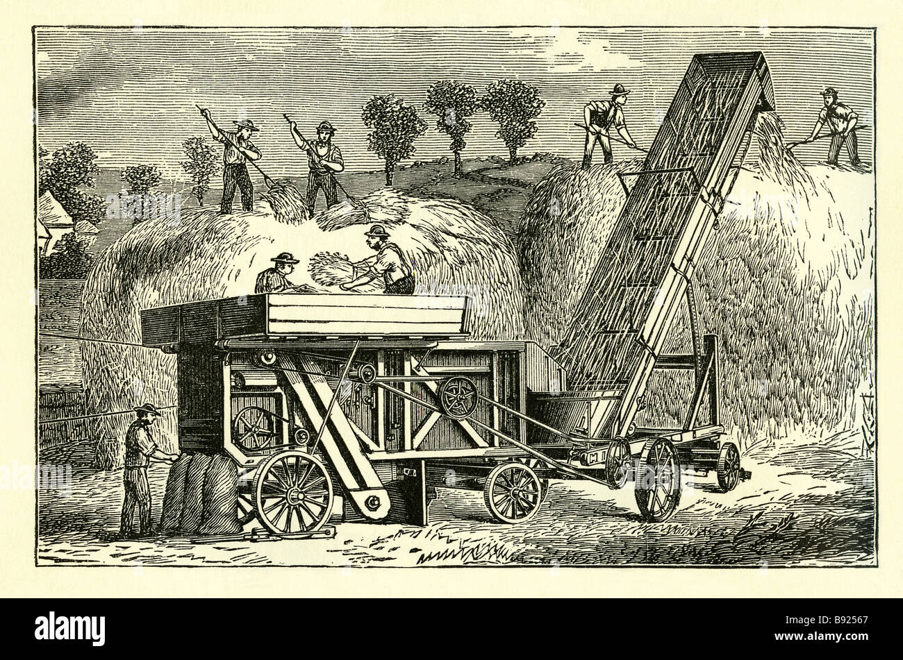 Portable threshing machine used on the farm in Victorian times Stock
