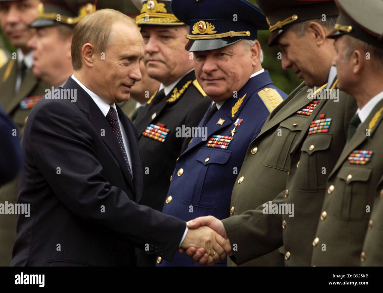 Russian President Vladimir Putin greeting Russian prominent military ...