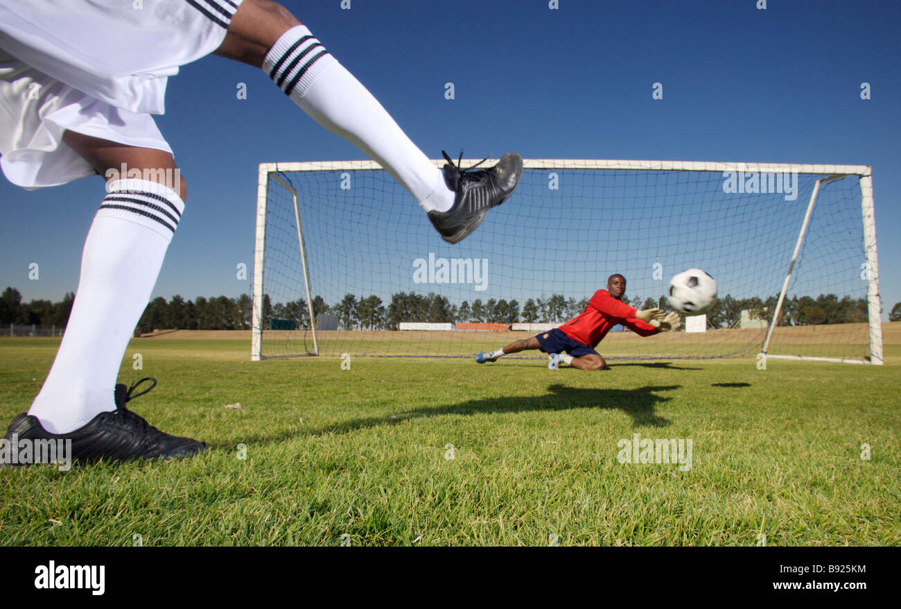 Action shot of a goalie stopping an attempt at goal Pretoria Gauteng Province South Africa Stock Photo