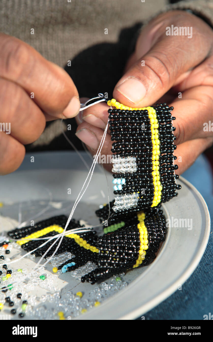 Close Up of women sewing African beaded crafts Grahamstown Eastern Cape