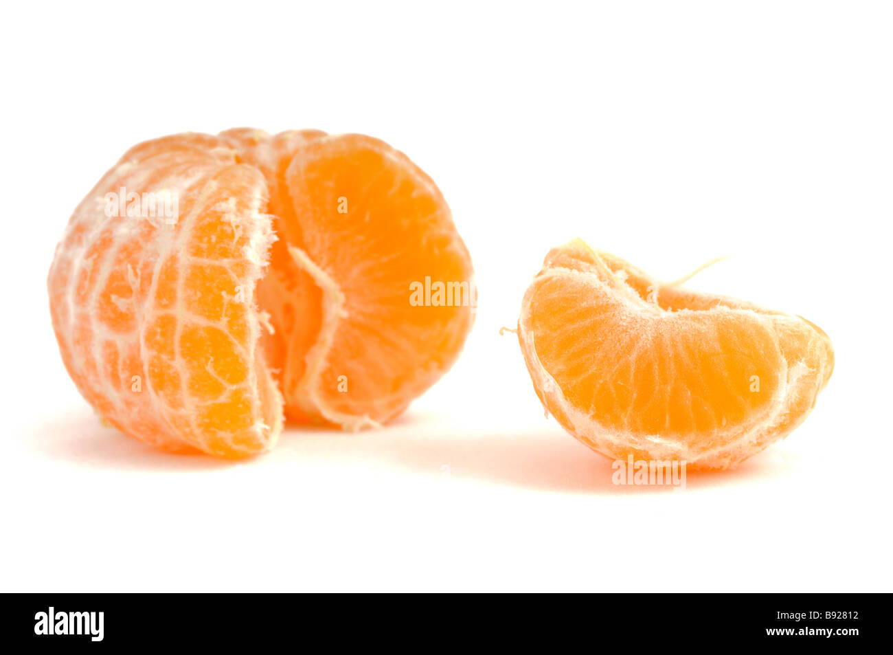 Peeled mandarine on a white background Stock Photo