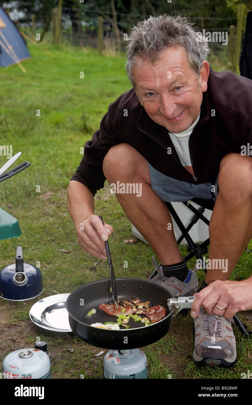 A camper cooking breakfast Stock Photo