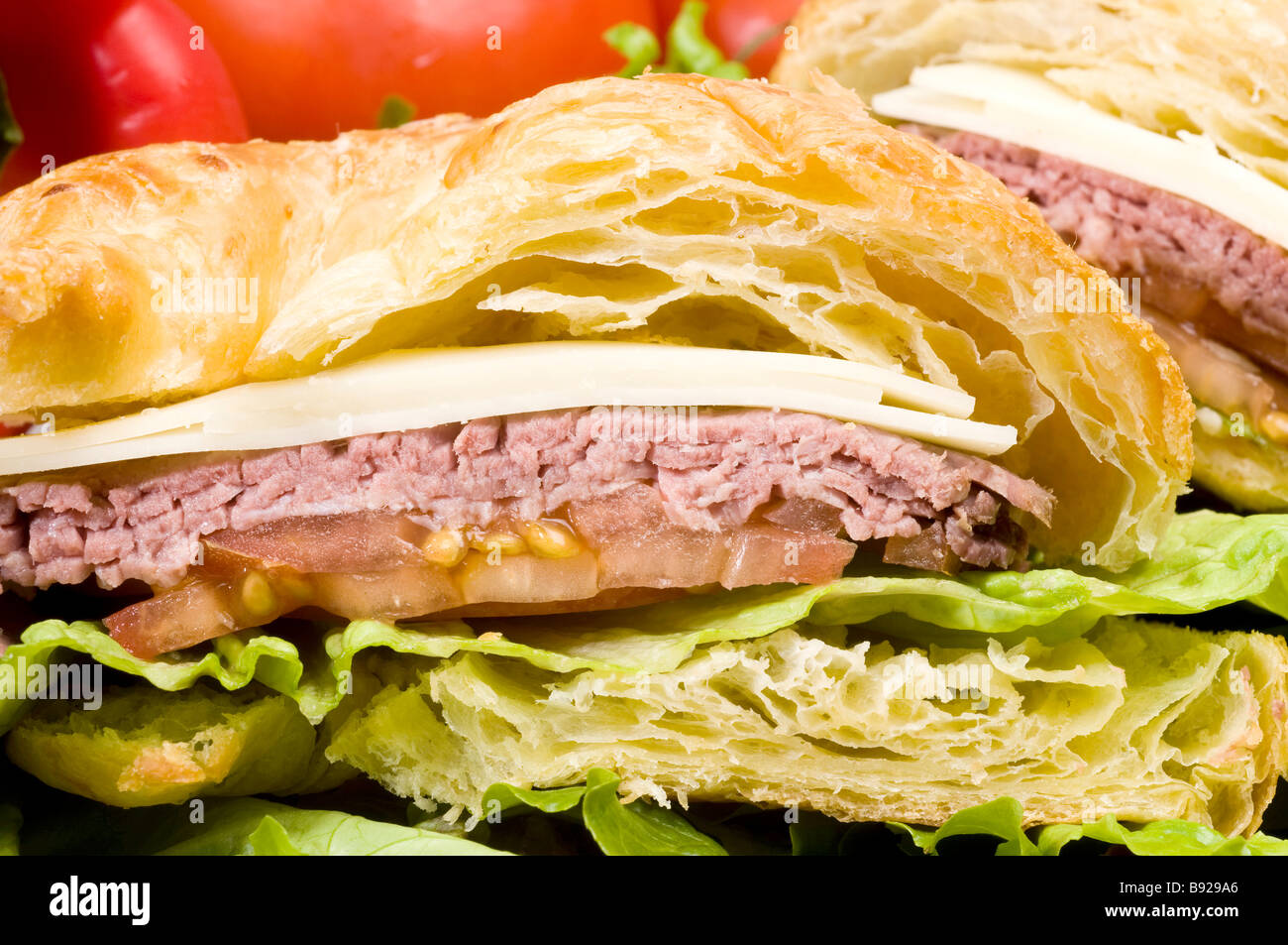 roast beef sandwich with swiss cheese on croissant french bread Stock