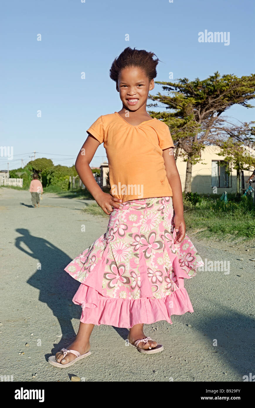 Girl in township with pretty skirt Sea Vista Eastern Cape South Africa Stock Photo
