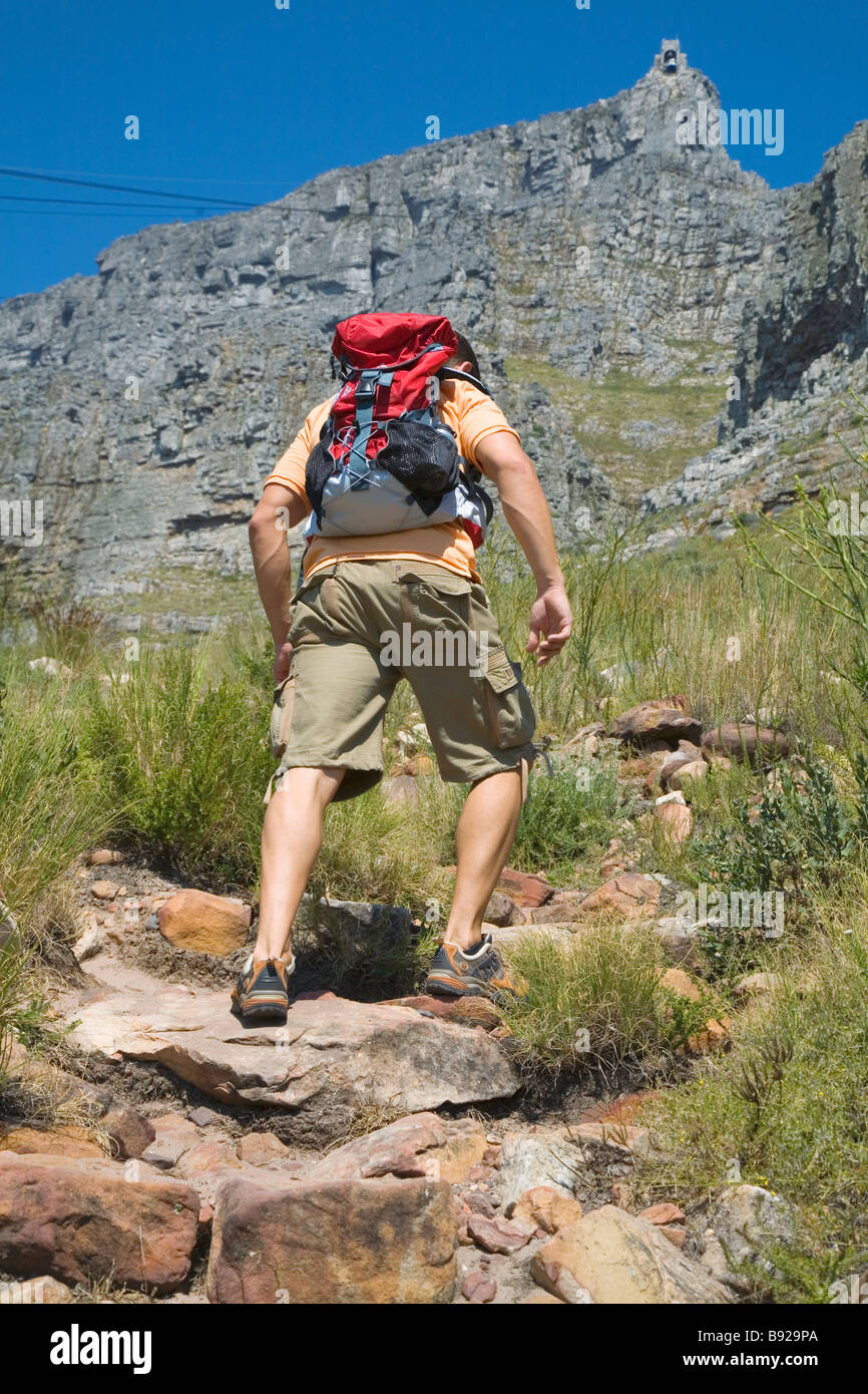 View from behind of man climbing Table Mountain Cape Town Western Cape