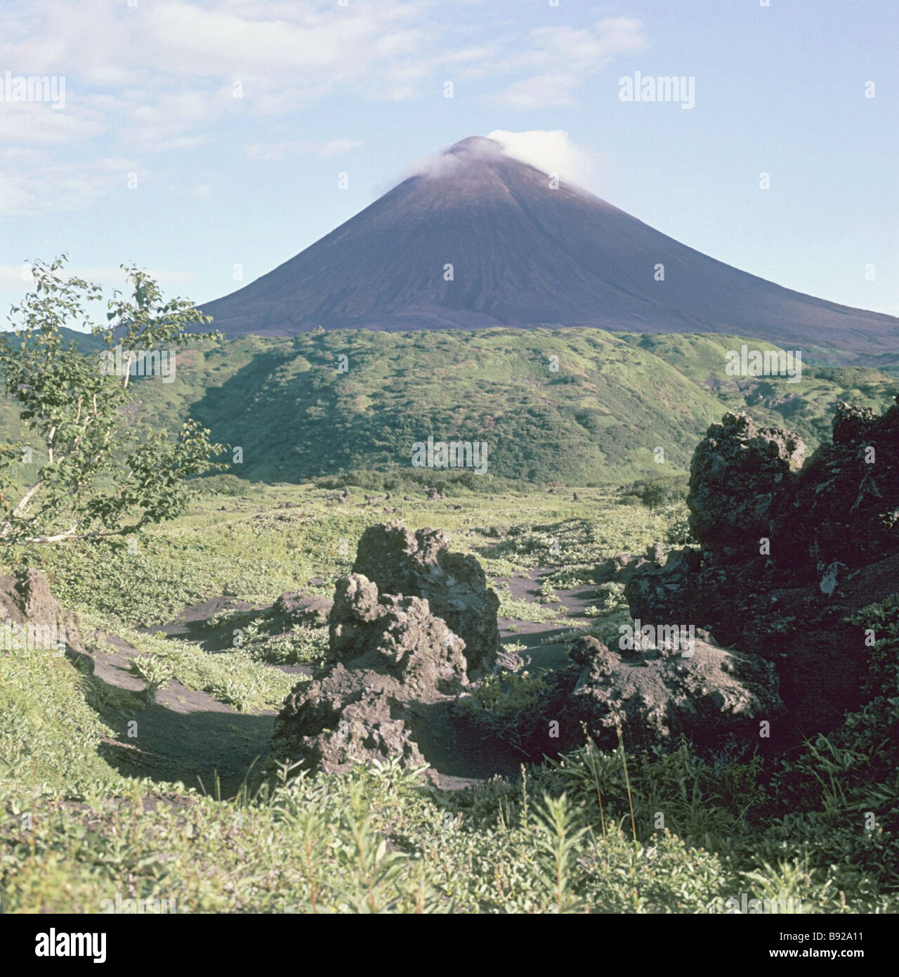 Volcanic bombs are being ejected from the Karymsky volcano crater in
