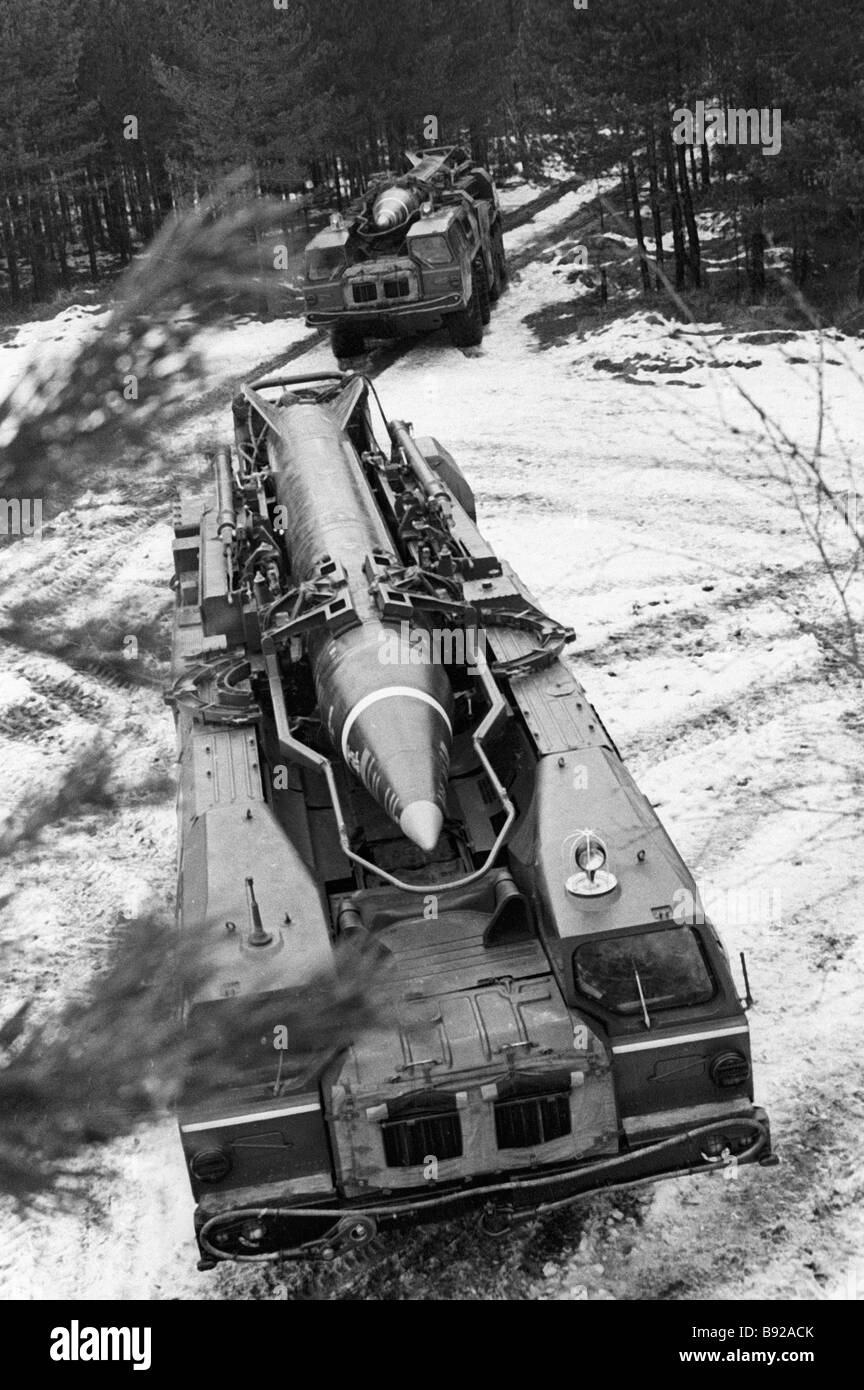 Self propelled missile launchers ride along forest road during exercise