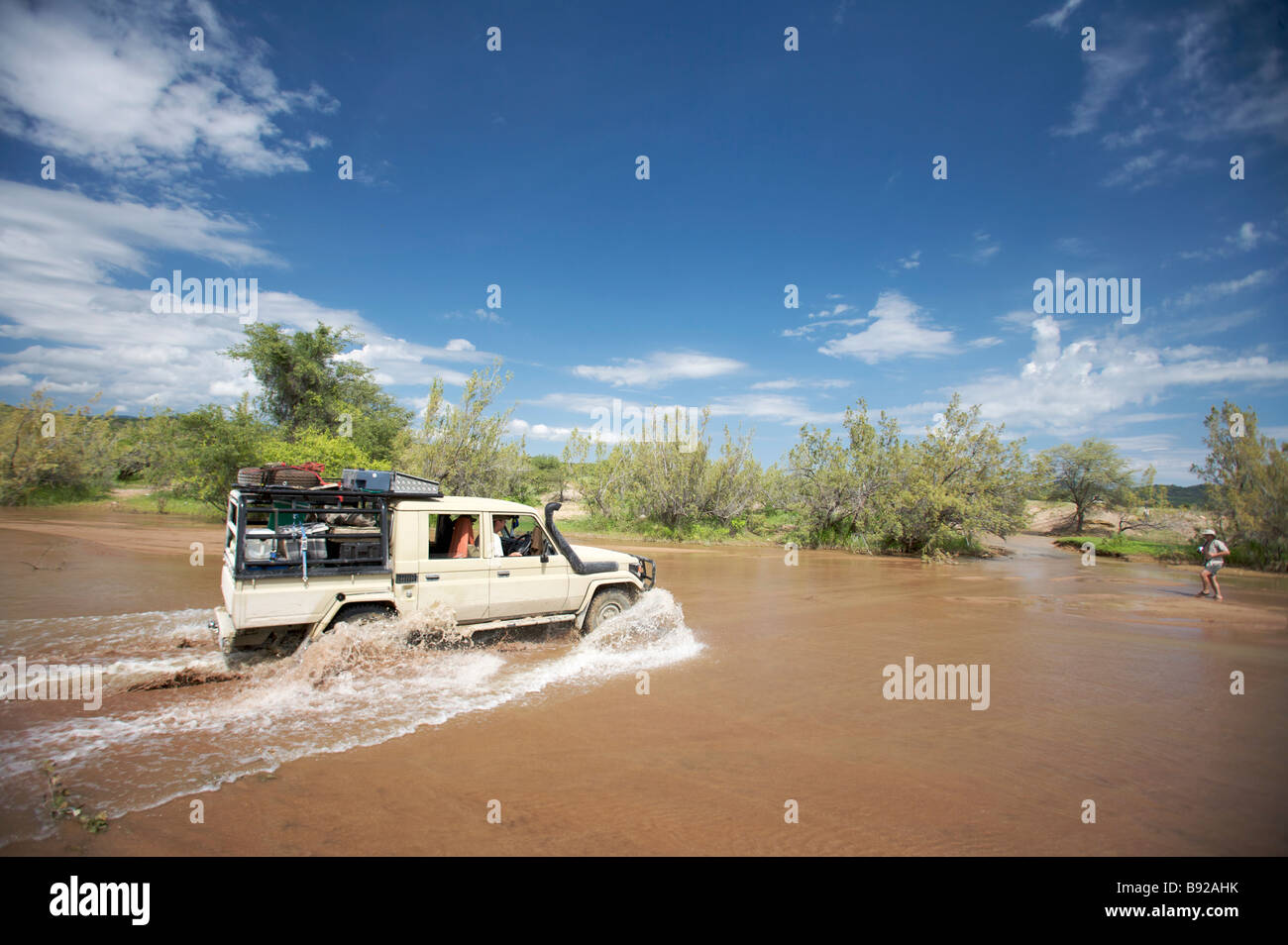 4x4 crossing river near Ruacana North Kaokoland Namibia Stock Photo