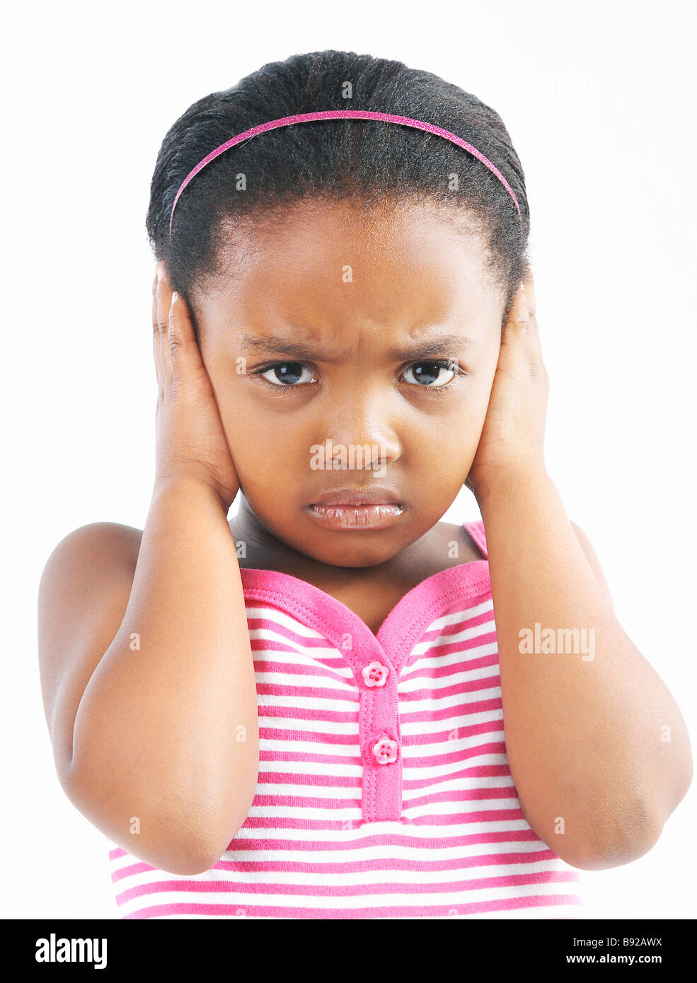 Angry young girl covering her ears Stock Photo Alamy