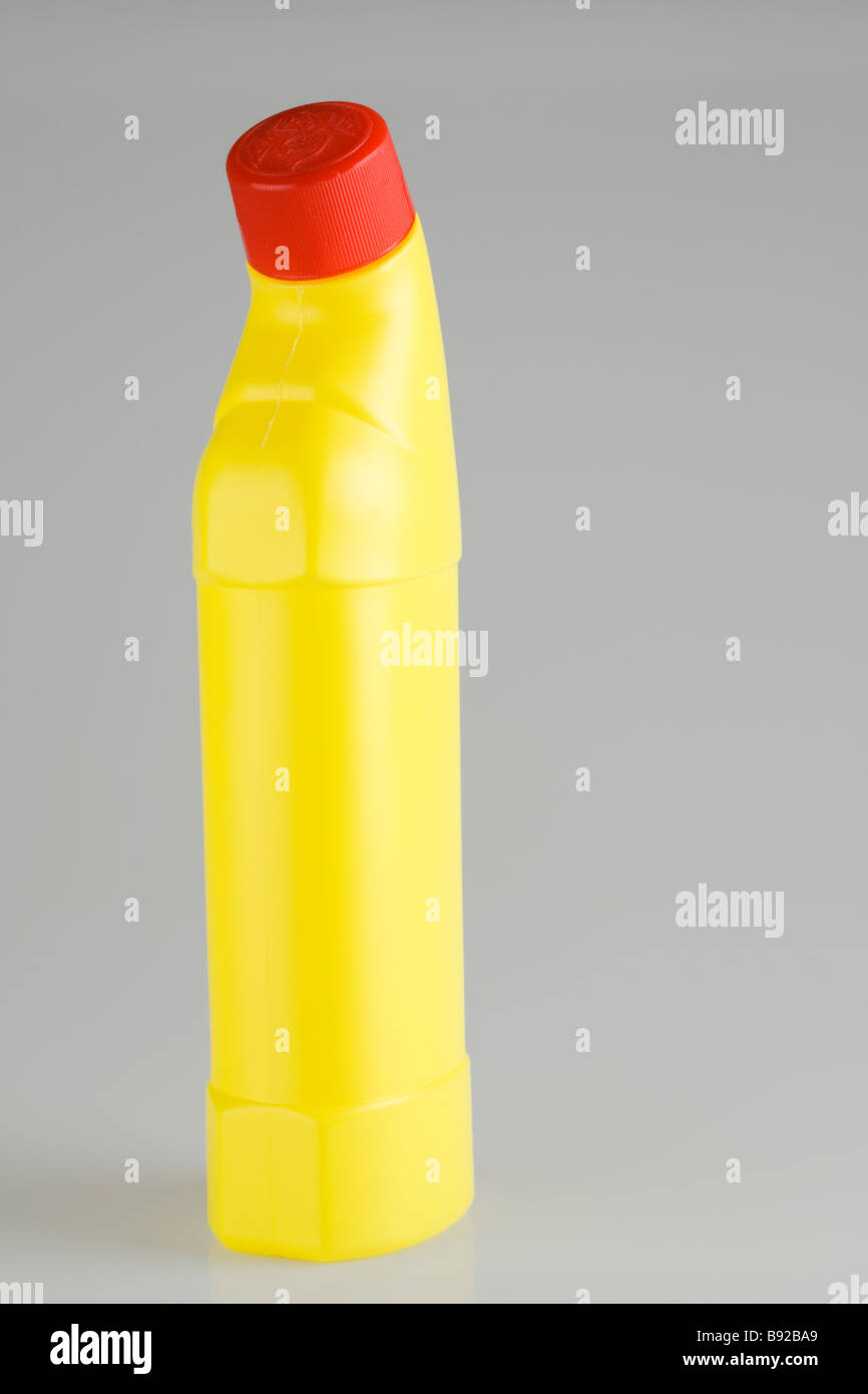 Yellow cleaning fluid bottle Stock Photo