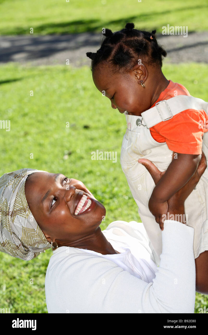 Happy mother holding her young daughter up Dewaal Park Cape Town