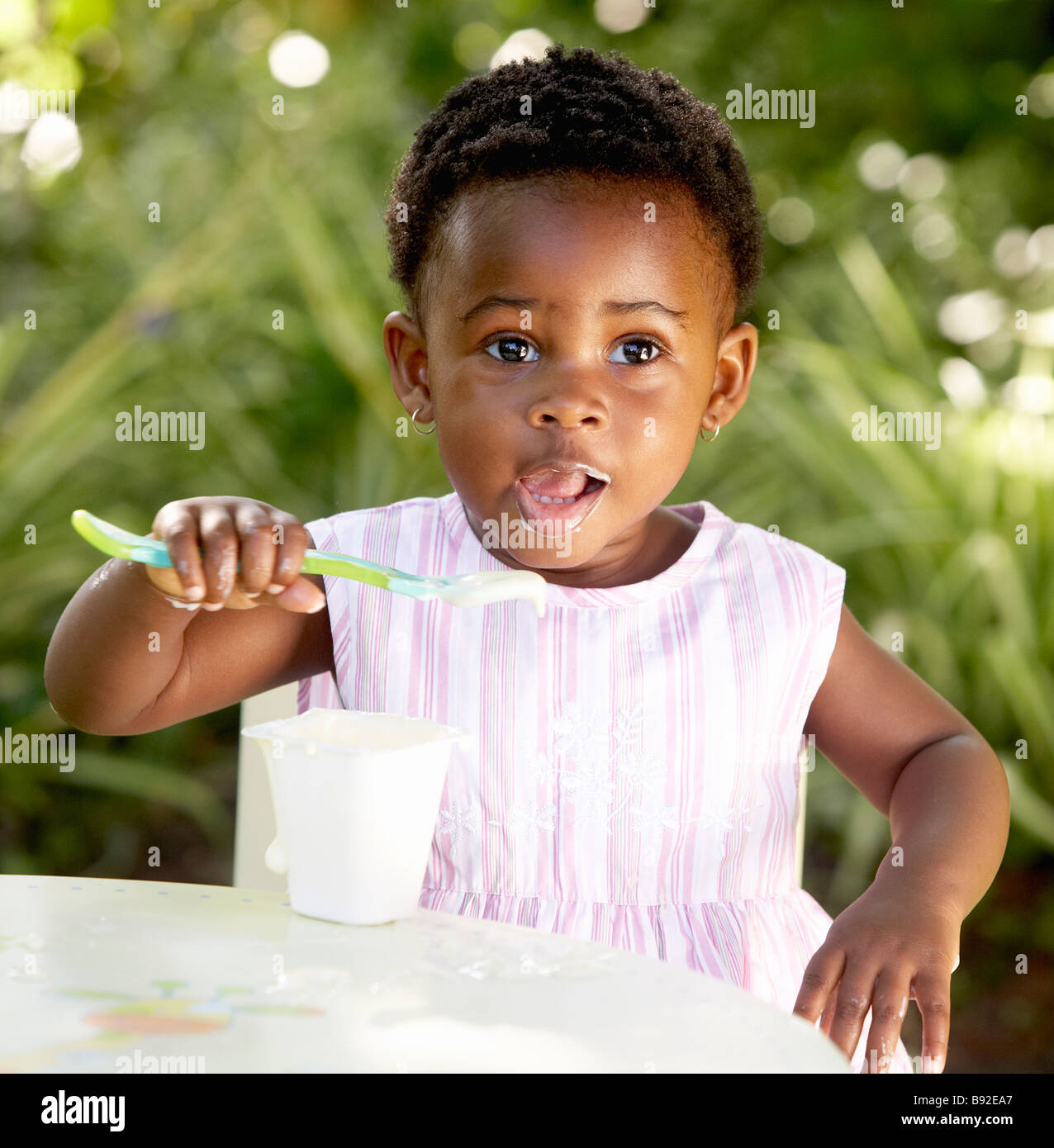 Baby girl eating yogurt outdoors Cape Town Western Cape Province South