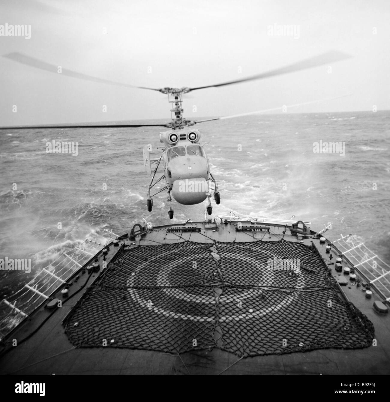 A KA 26 antisubmarine helicopter lands on its carrier deck Stock Photo