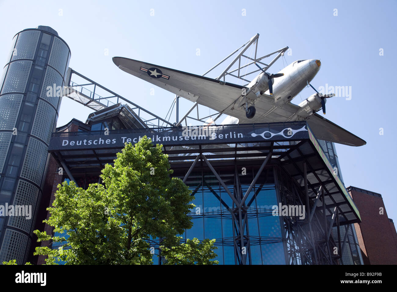 A Douglas C 47 sits on the roof of the Deutsches Technikmuseum in Berlin Germany Stock Photo