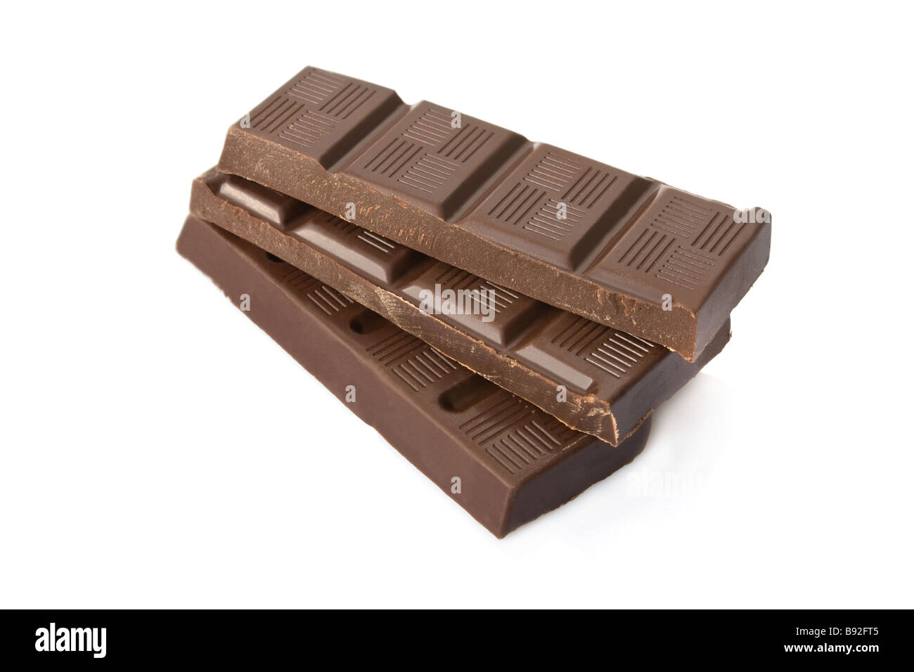 Broken dark chocolate bar isolated on white background Stock Photo