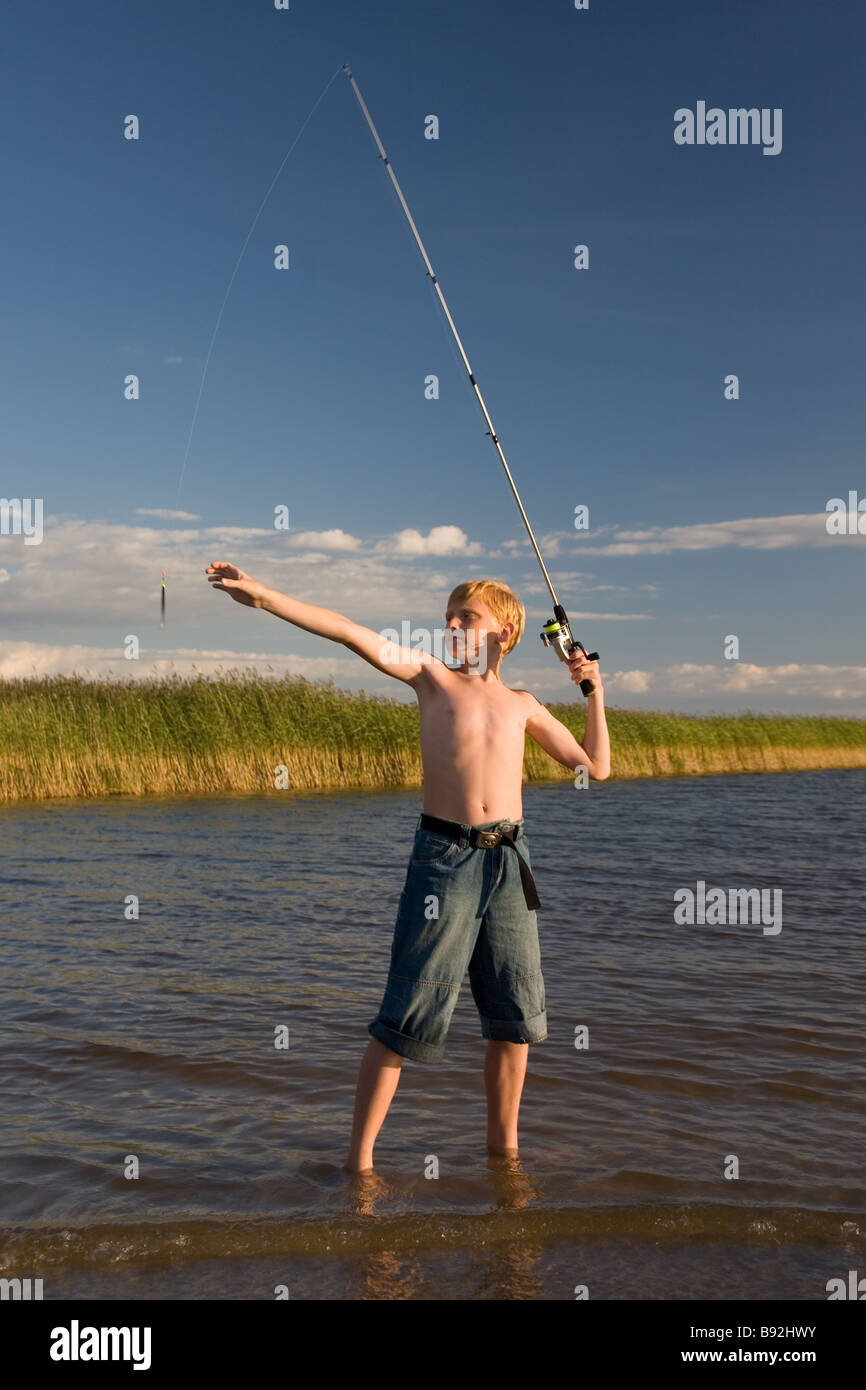 Boy Fishing on Lake Võrtsjärv, Tartu County, Estonia Stock Photo