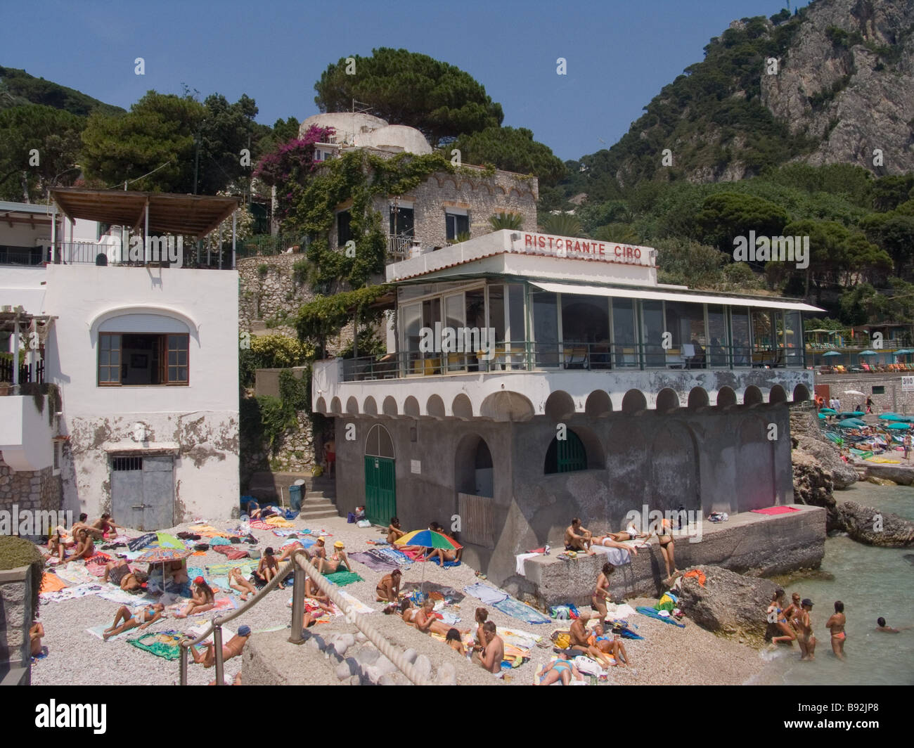 Sunbathers on beach at Marina Piccola Capri Island Italy Stock Photo