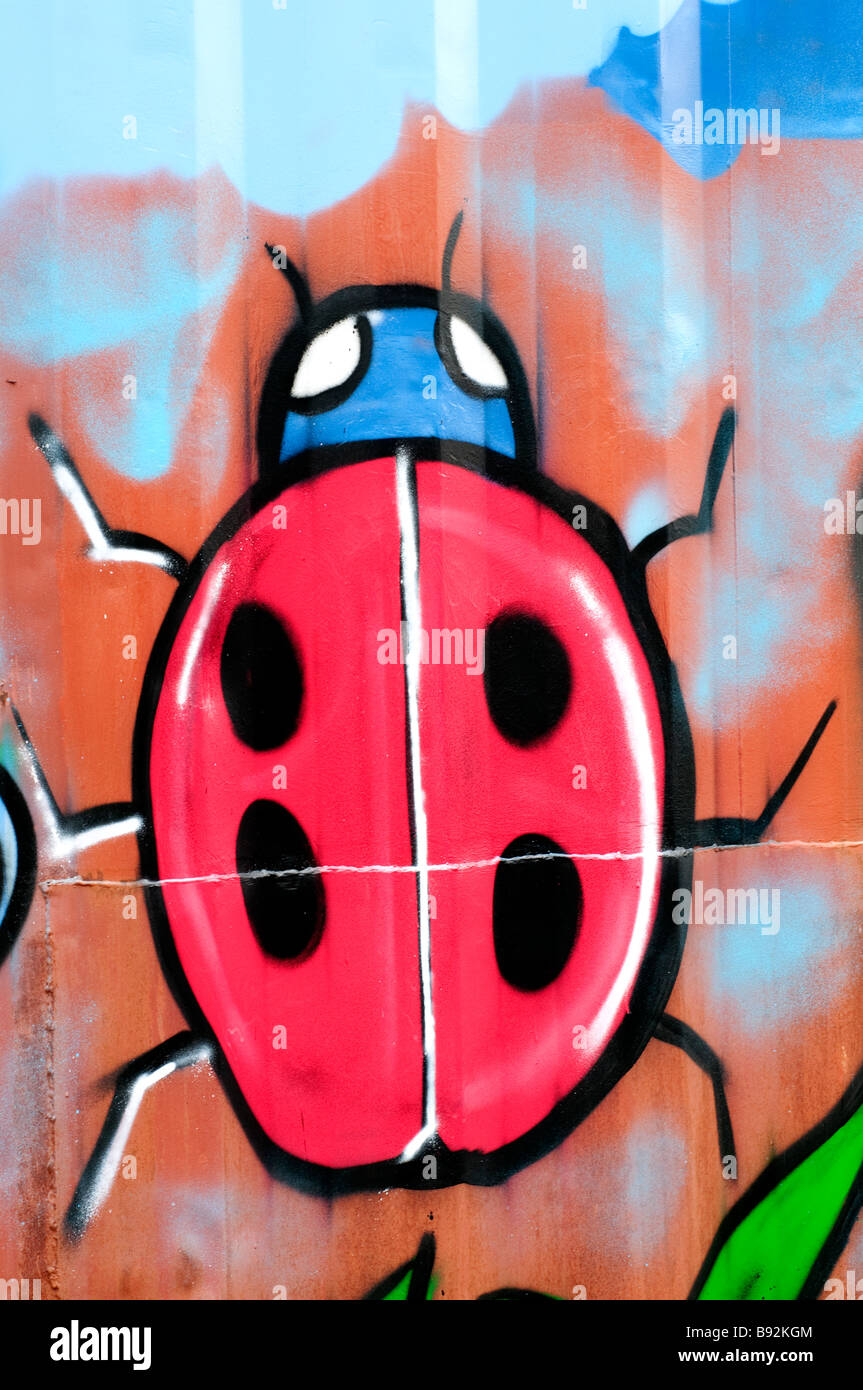 A ladybug painted on a waste container in a school yard Stock Photo - Alamy