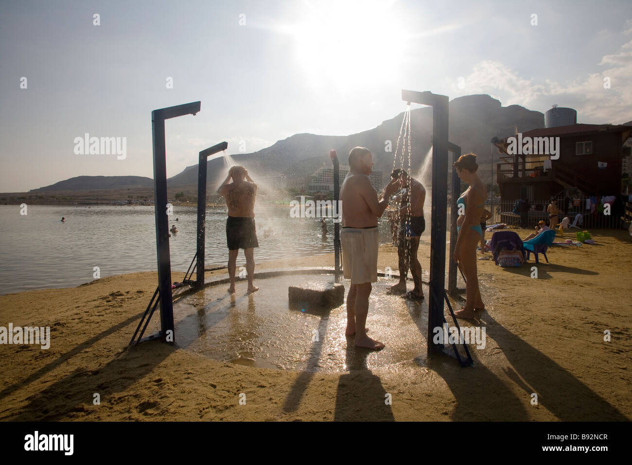 Tourists showering at Dead Sea beach showers, Israel, Middle East Stock